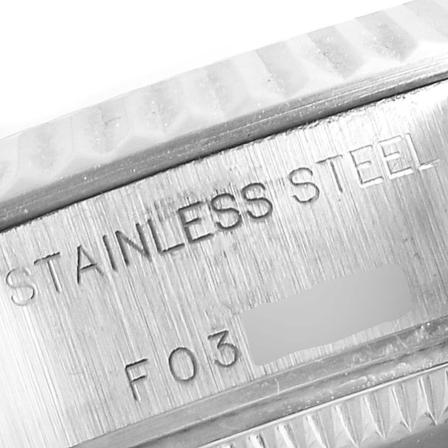 This image shows a close-up of the stainless steel case back of a Rolex Datejust 79174 Women
s Stainless Steel White Dial 79174 Women
s Stainless Steel White Dial watch.