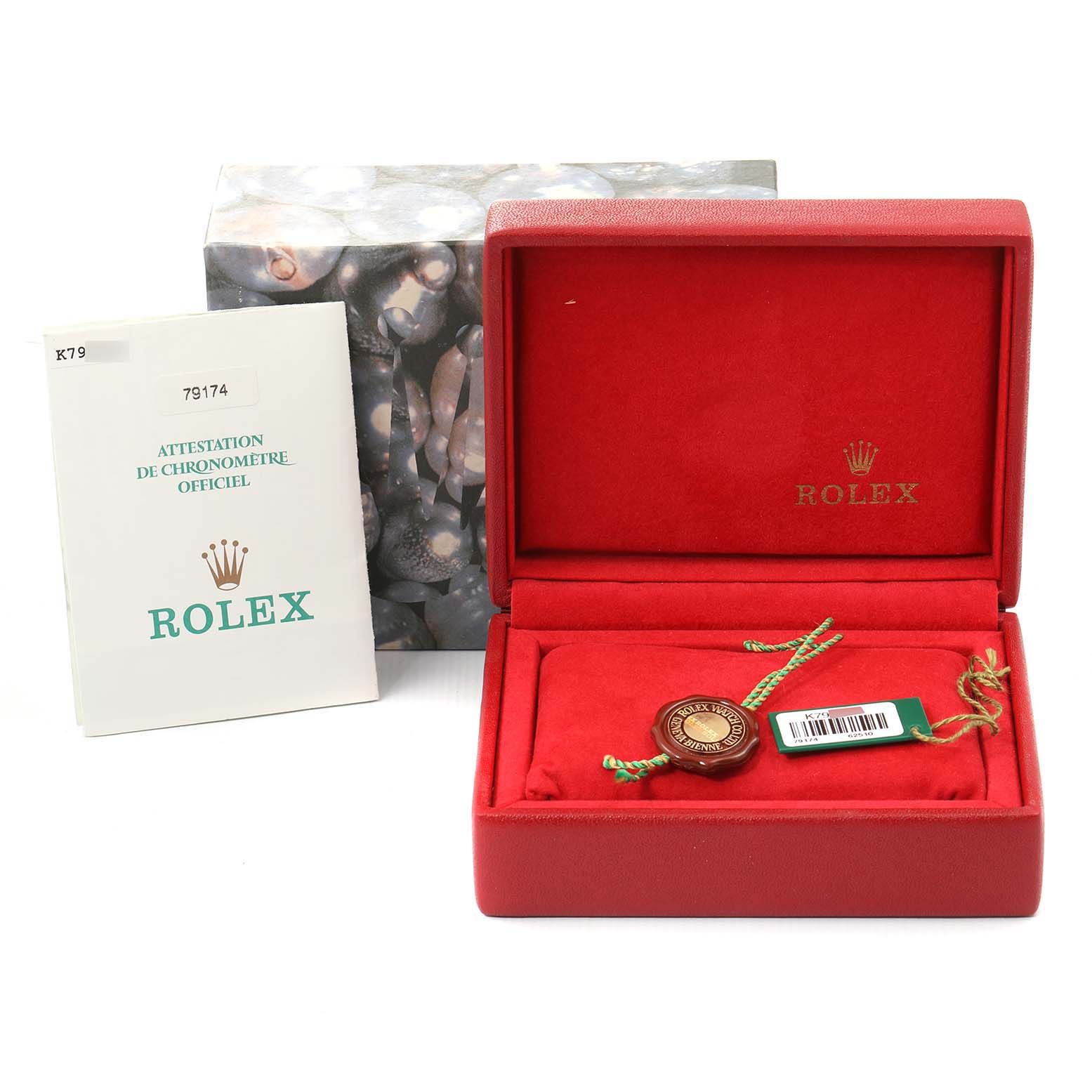 The image shows the packaging and accessories for a Rolex Datejust 79174 Women's Stainless Steel Pink Dial 79174 Women's Stainless Steel Pink Dial, including a red box, tags, and documentation.