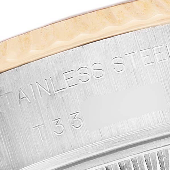 The image shows a close-up view of the side of a Rolex Datejust 69173 Women's Stainless Steel Champagne Dial, highlighting the stainless steel part of the watch case.