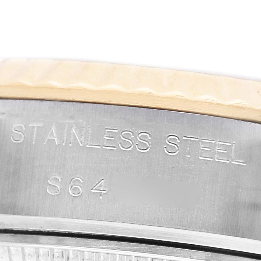 The image shows a close-up of the Rolex Datejust 69173 Women's Stainless Steel Grey Dial's bezel and engraved text on its side, indicating "STAINLESS STEEL."