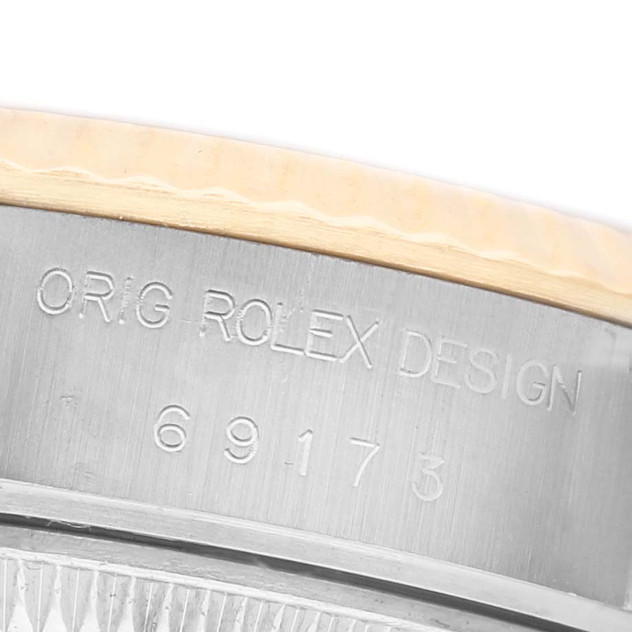 The image shows a close-up of the case side of a Rolex Datejust 69173 Women's Stainless Steel Grey Dial, featuring the engraved design and model number.