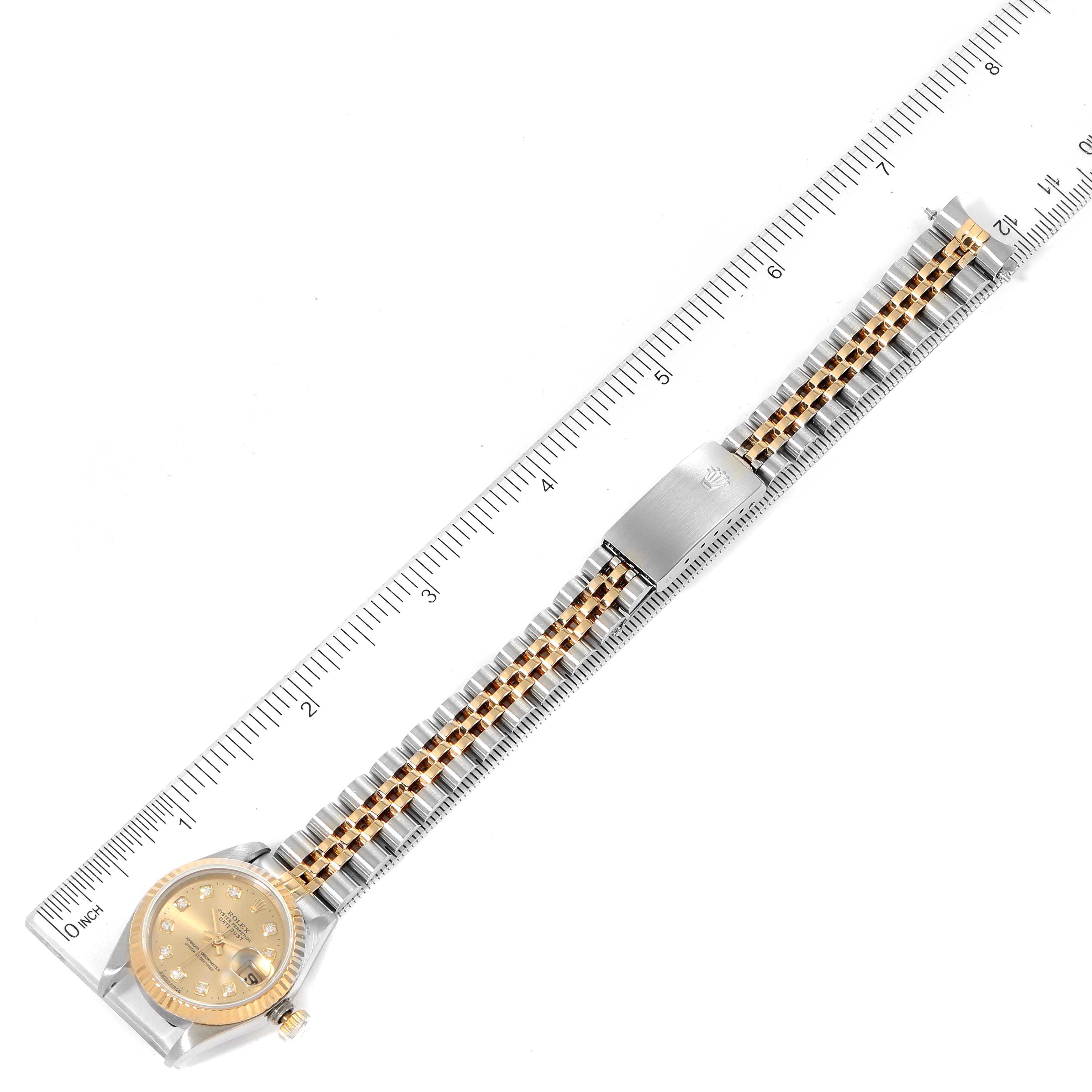 The Rolex Datejust 69173 Women
s Steel and Gold (two tone) Champagne Dial 69173 Women
s Steel and Gold (two tone) Champagne Dial watch is shown from an overhead angle, displaying its face, band, and clasp.