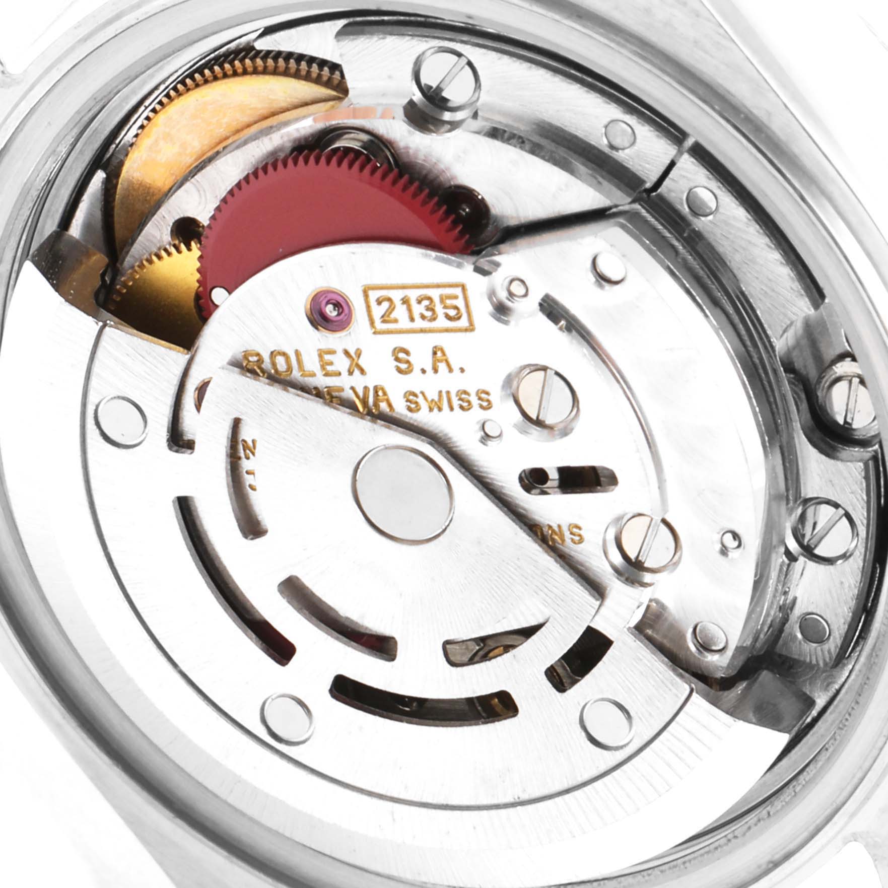 This image shows the internal movement mechanism of a Rolex Datejust 69173 Women
s Steel and Gold (two tone) Champagne Dial 69173 Women
s Steel and Gold (two tone) Champagne Dial watch, showcasing gears and the inscription "2135."