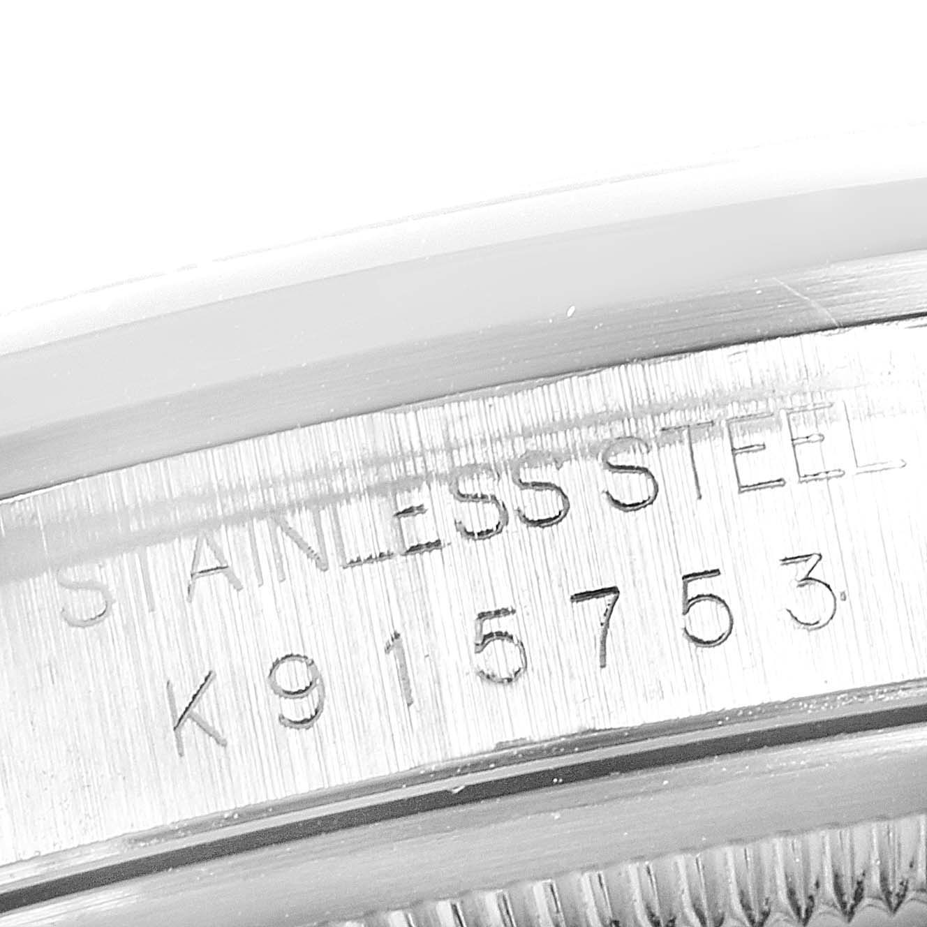 The image shows a close-up of the serial number engraved on the stainless steel case of a Rolex Datejust 16200 Men's Stainless Steel Blue Dial 16200 Men's Stainless Steel Blue Dial watch.