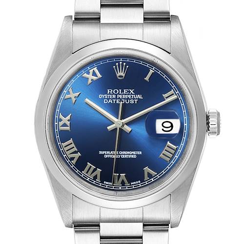 The image shows a front view of a Rolex Datejust watch with a blue dial, Roman numeral markers, and a date display at 3 o'clock.