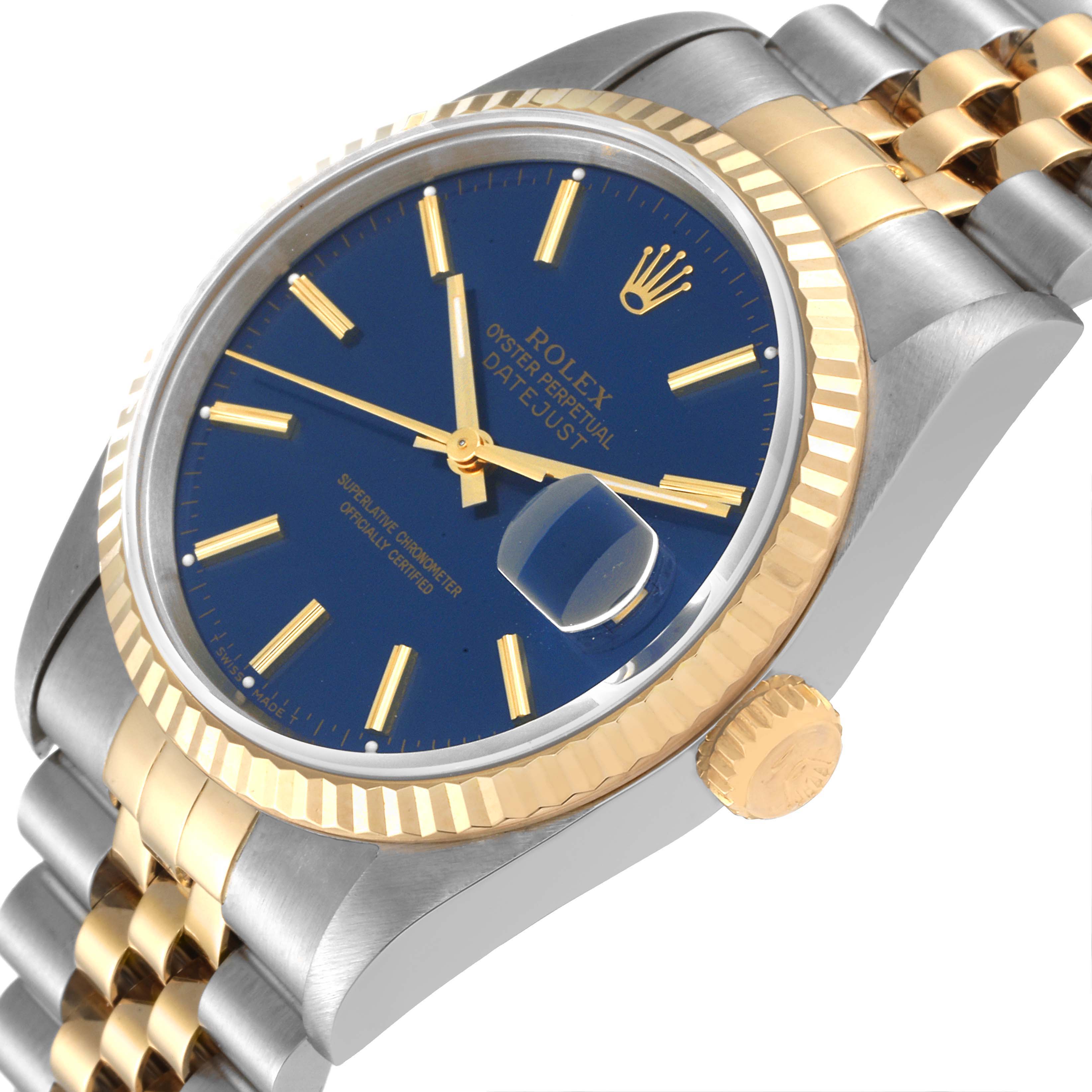 The Rolex Datejust 16233 Men's Steel and Gold (two tone) Blue Dial 16233 Men's Steel and Gold (two tone) Blue Dial watch is shown at a slight side angle, highlighting the blue dial, fluted bezel, crown, and part of the bracelet.