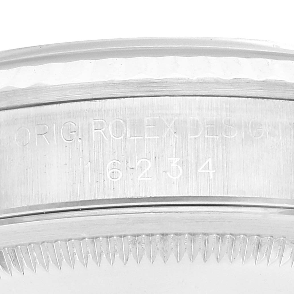 The image shows a close-up view of the side of the Rolex Datejust 16234 Men's Stainless Steel Blue Dial 16234 Men's Stainless Steel Blue Dial watch case with its model number engraved.