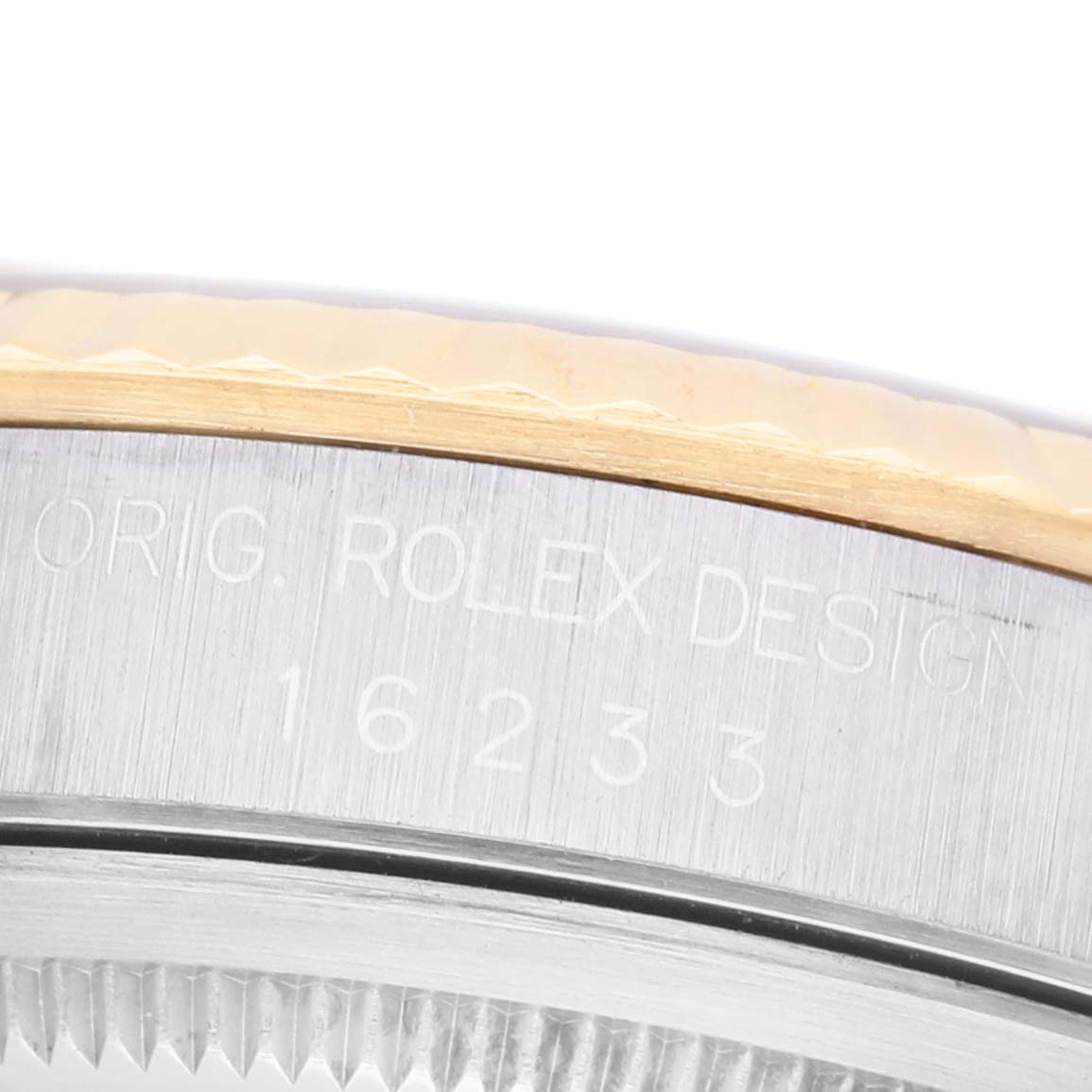 The image shows a close-up of the casing edge with engravings on the Rolex Datejust 16233 Men's Stainless Steel Blue Dial watch.
