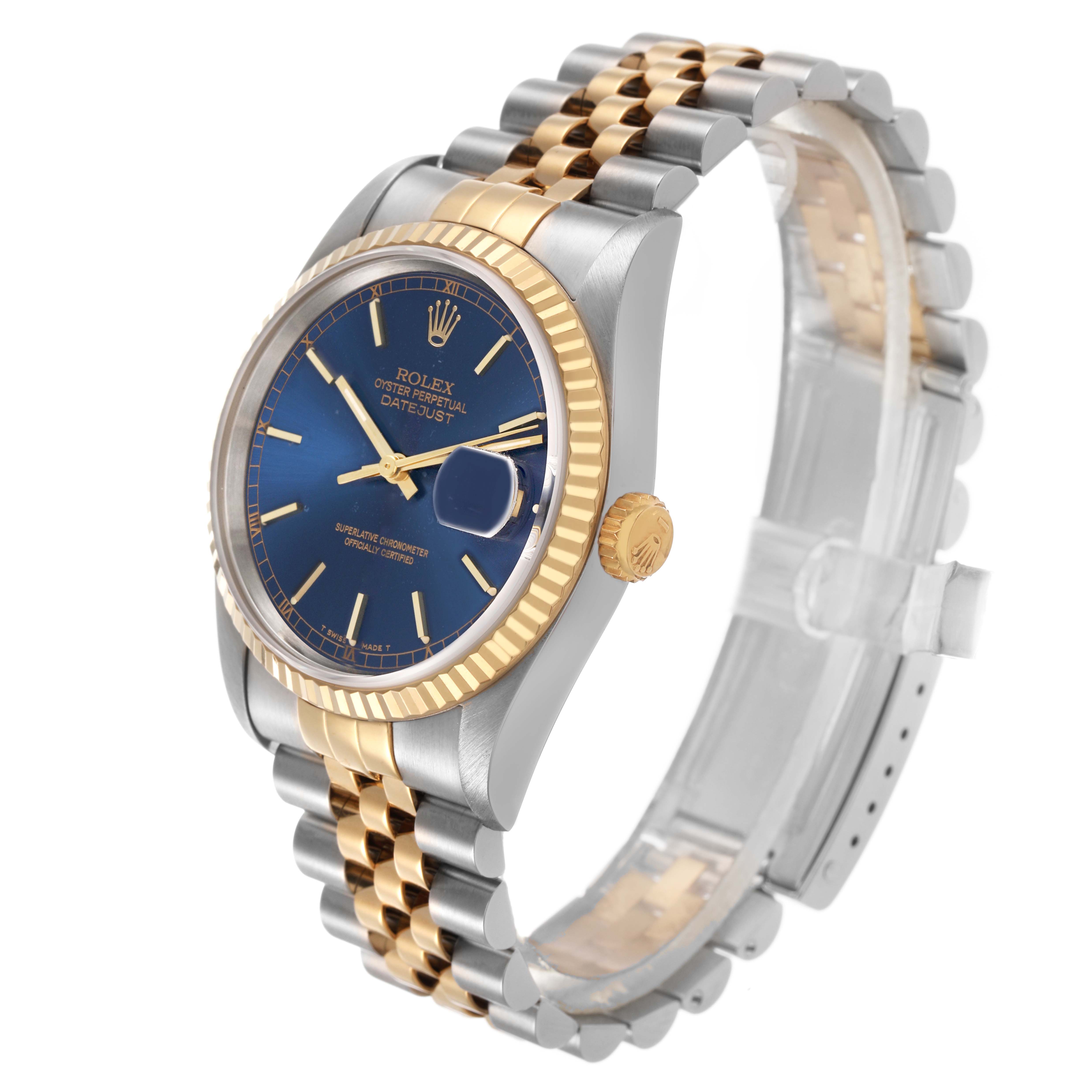 The Rolex Datejust 16233 Men's Stainless Steel Blue Dial watch is shown at a three-quarter angle, highlighting its blue dial, gold fluted bezel, and two-tone bracelet.
