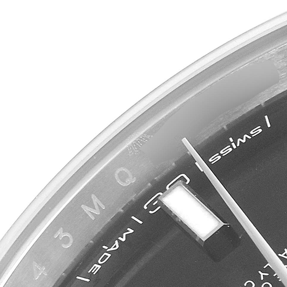 This close-up image of the Rolex Datejust 41 126300 Men
s Stainless Steel Black Dial 126300 Men
s Stainless Steel Black Dial watch shows part of the dial and the "Swiss Made" text.