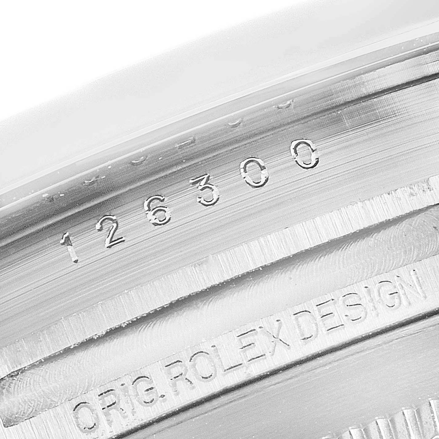 This image shows a close-up of the inner case with engraved serial numbers and "ORIG. ROLEX DESIGN" on the Rolex Datejust 41 126300 Men
s Stainless Steel Black Dial 126300 Men
s Stainless Steel Black Dial watch.