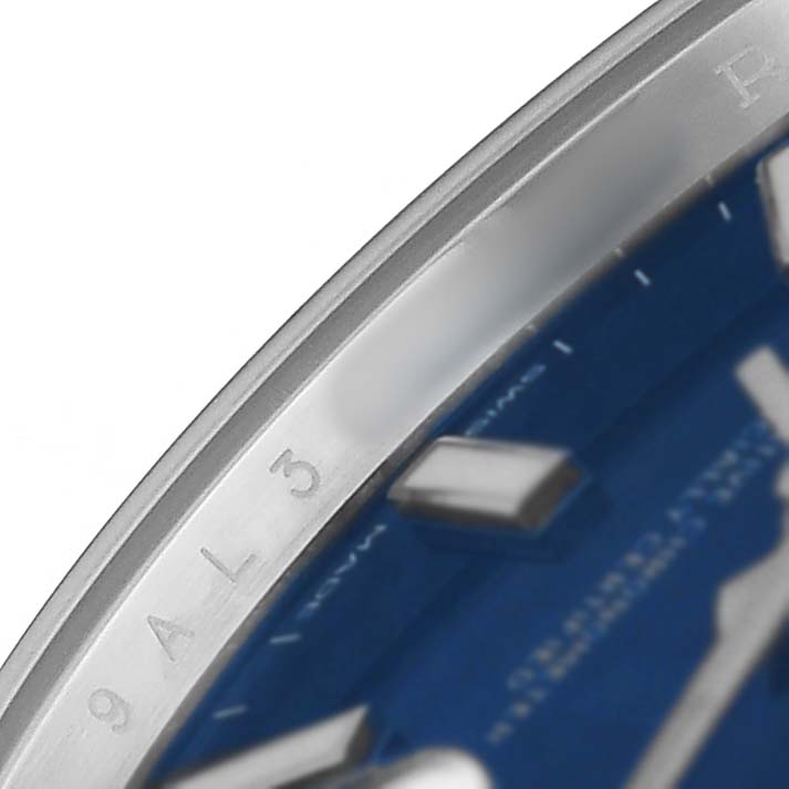 The image shows a close-up of the bezel and part of the dial on a Rolex Datejust 41 126334 Men's Stainless Steel Blue Dial, focusing on the edge's engravings and markers.