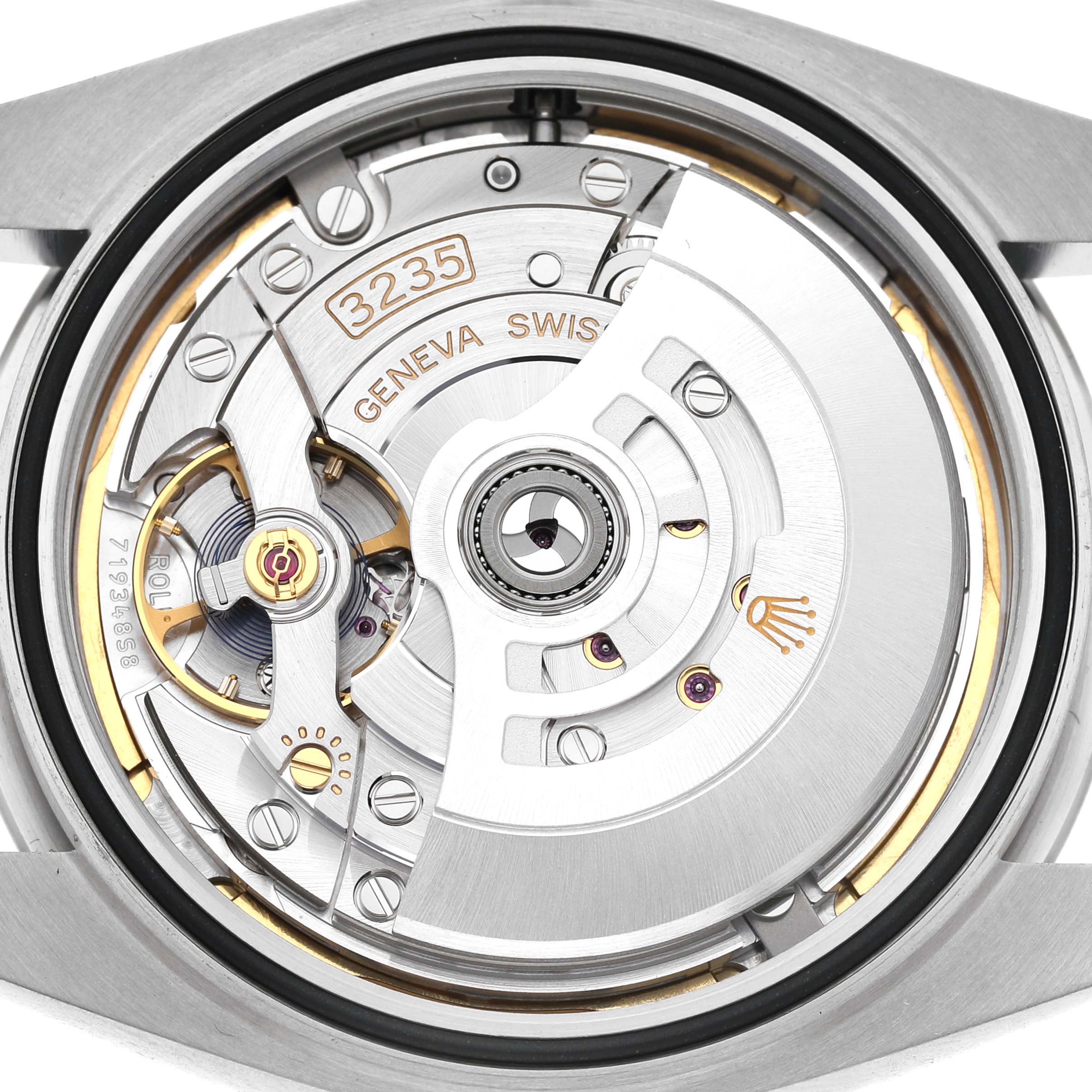 The image shows the movement mechanism of the Rolex Datejust 41 126300 Men's Stainless Steel Blue Dial, highlighting the intricate components of its caliber 3235.