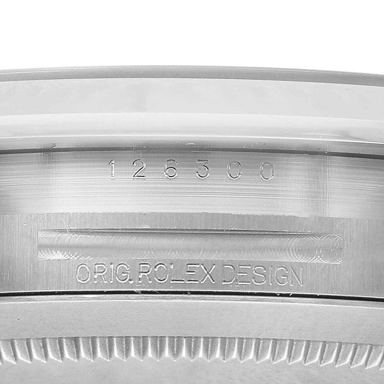 The image shows the side of the Rolex Datejust 41 126300 Men's Stainless Steel Blue Dial's case, featuring engraved model number and design details.