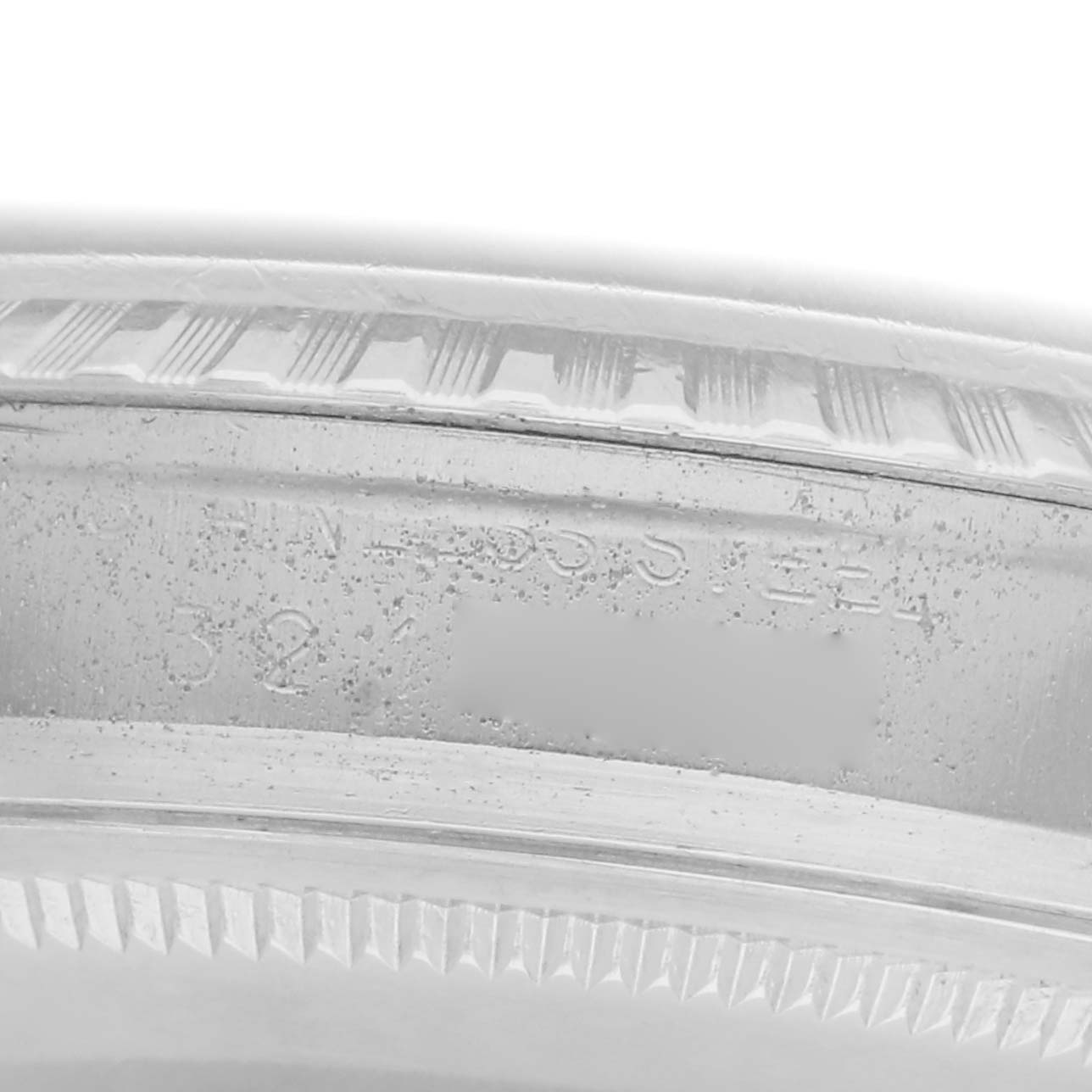 The image shows a close-up of the case's inner edge with engraved details of the Rolex Vintage Collection model 1603 men's watch.