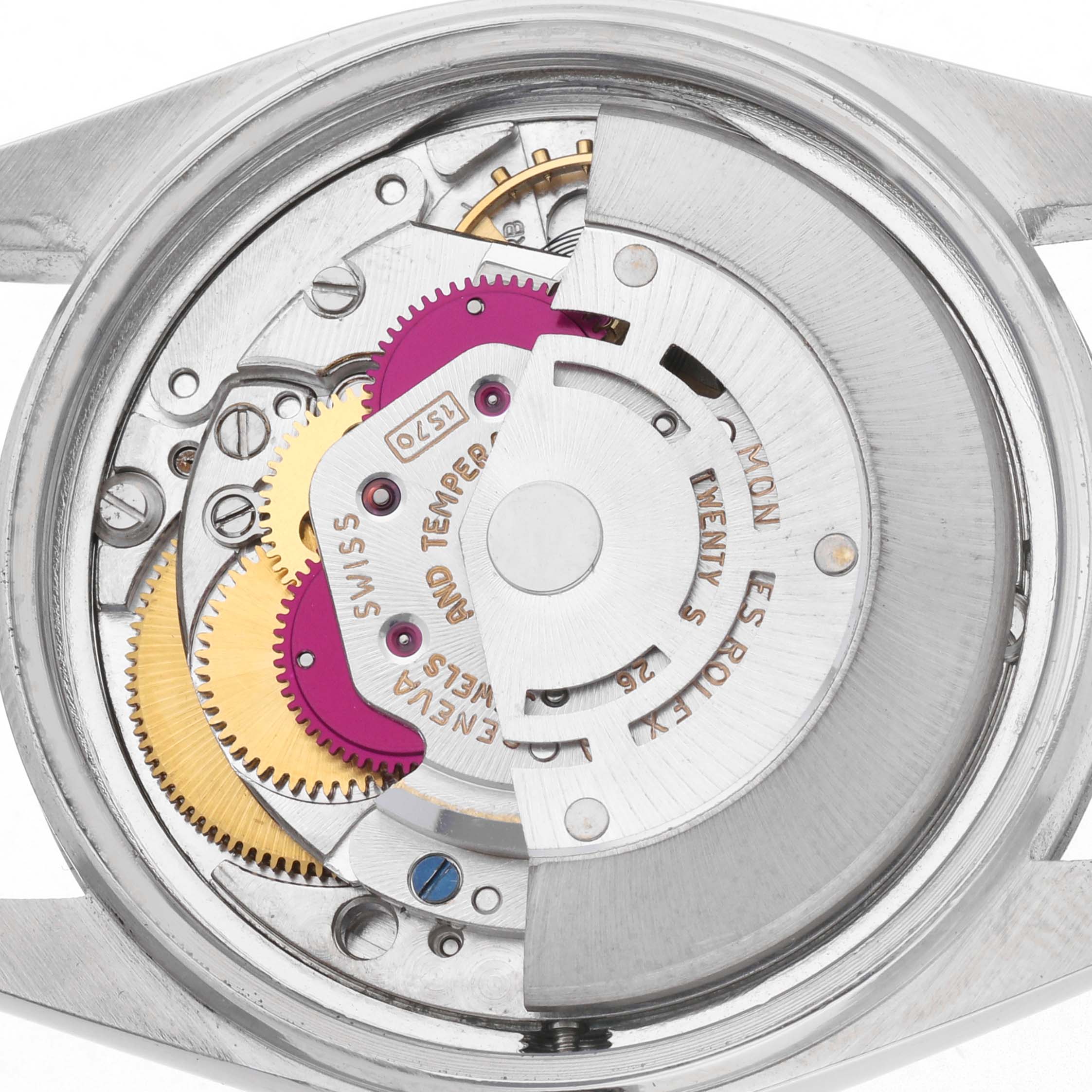 The image shows the internal movement of the Rolex Vintage Collection model 1603 from a top-down angle, highlighting gears and intricate mechanical parts.