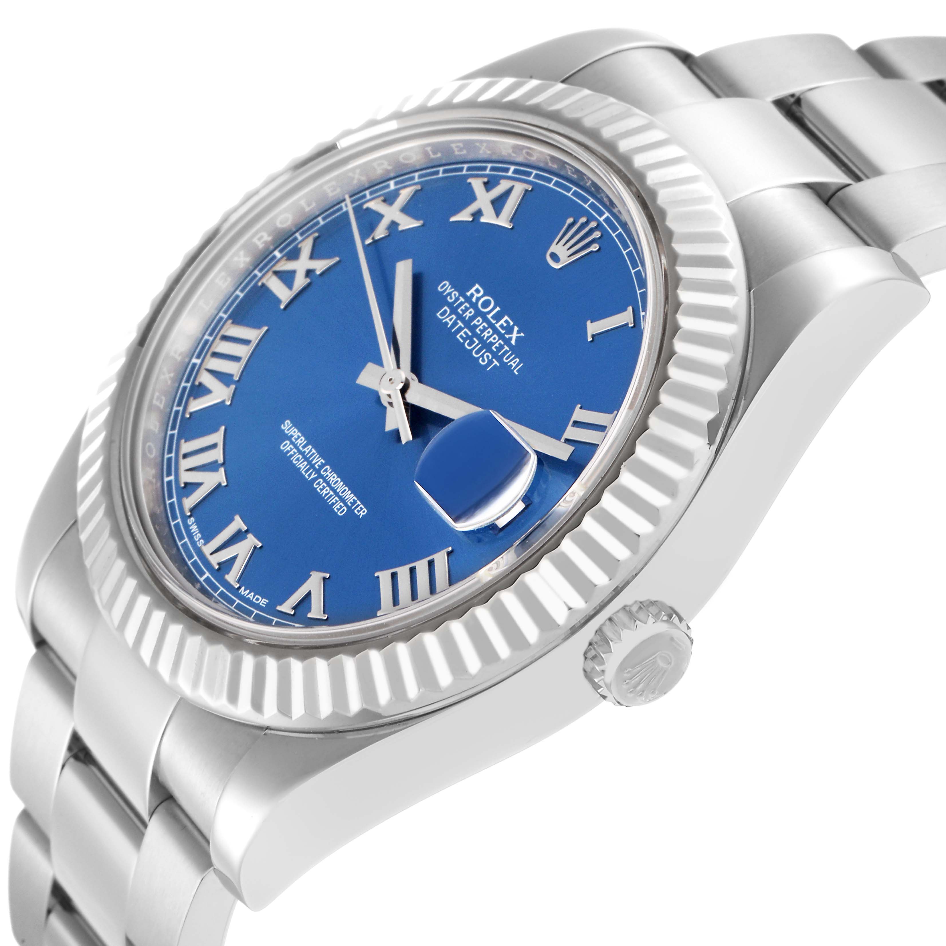 The Rolex Datejust 41 model (116334) is shown at an oblique angle highlighting the blue dial, Roman numerals, fluted bezel, and part of the bracelet.