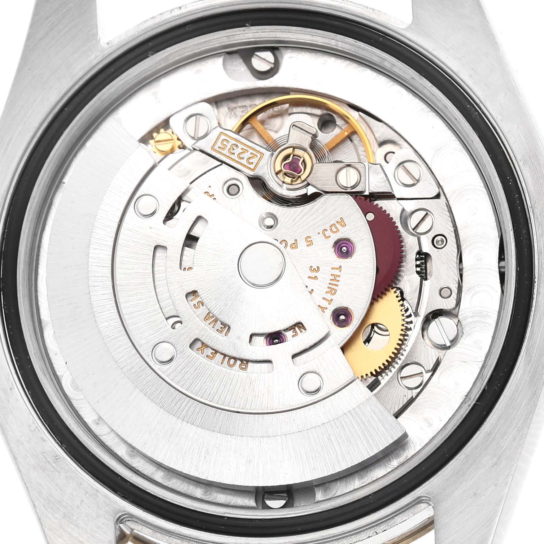 The image shows the internal mechanism of a Rolex Mid-Size 178273 Women's Steel and Gold (two tone) Champagne Dial watch from a top-down angle, highlighting gears and movement components.
