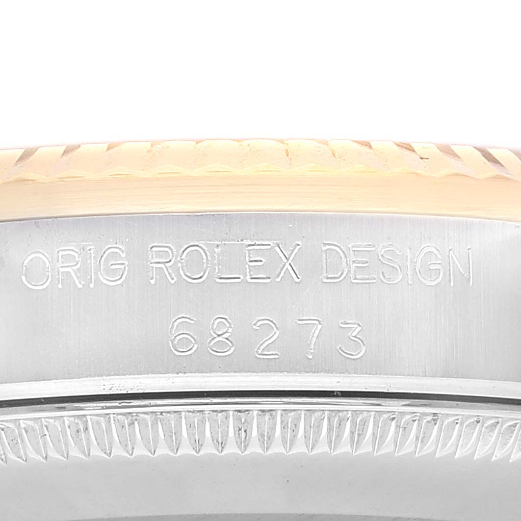 This image shows a close-up of the case side of a Mid-Size Rolex watch, revealing its model number "68273" and "ORIG ROLEX DESIGN" engraving.