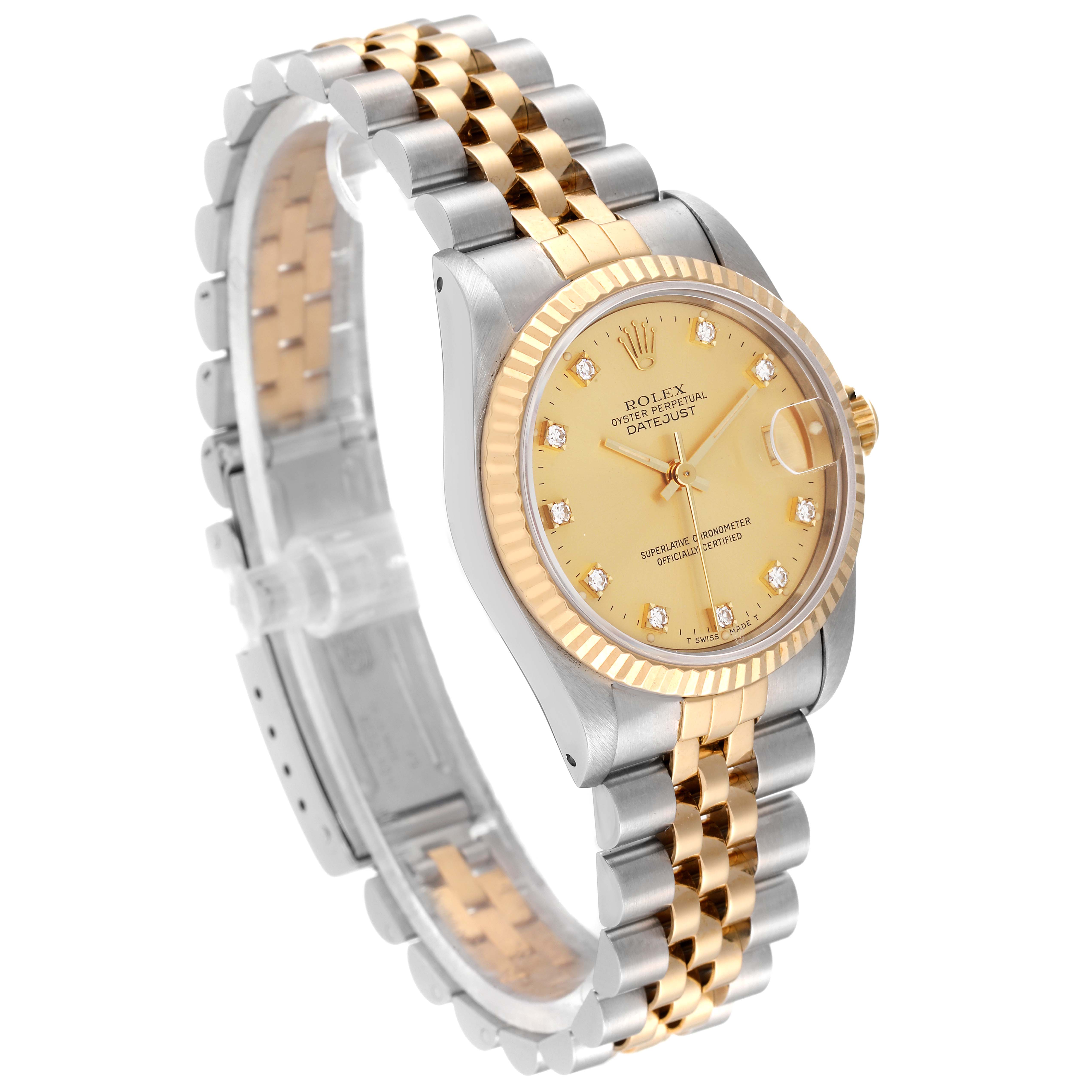 This Rolex Mid-Size 68273 Women
s Steel and Gold (two tone) Champagne Dial 68273 Women
s Steel and Gold (two tone) Champagne Dial Datejust watch is shown from a three-quarter angle, displaying its two-tone bracelet, fluted bezel, and champagne dial.