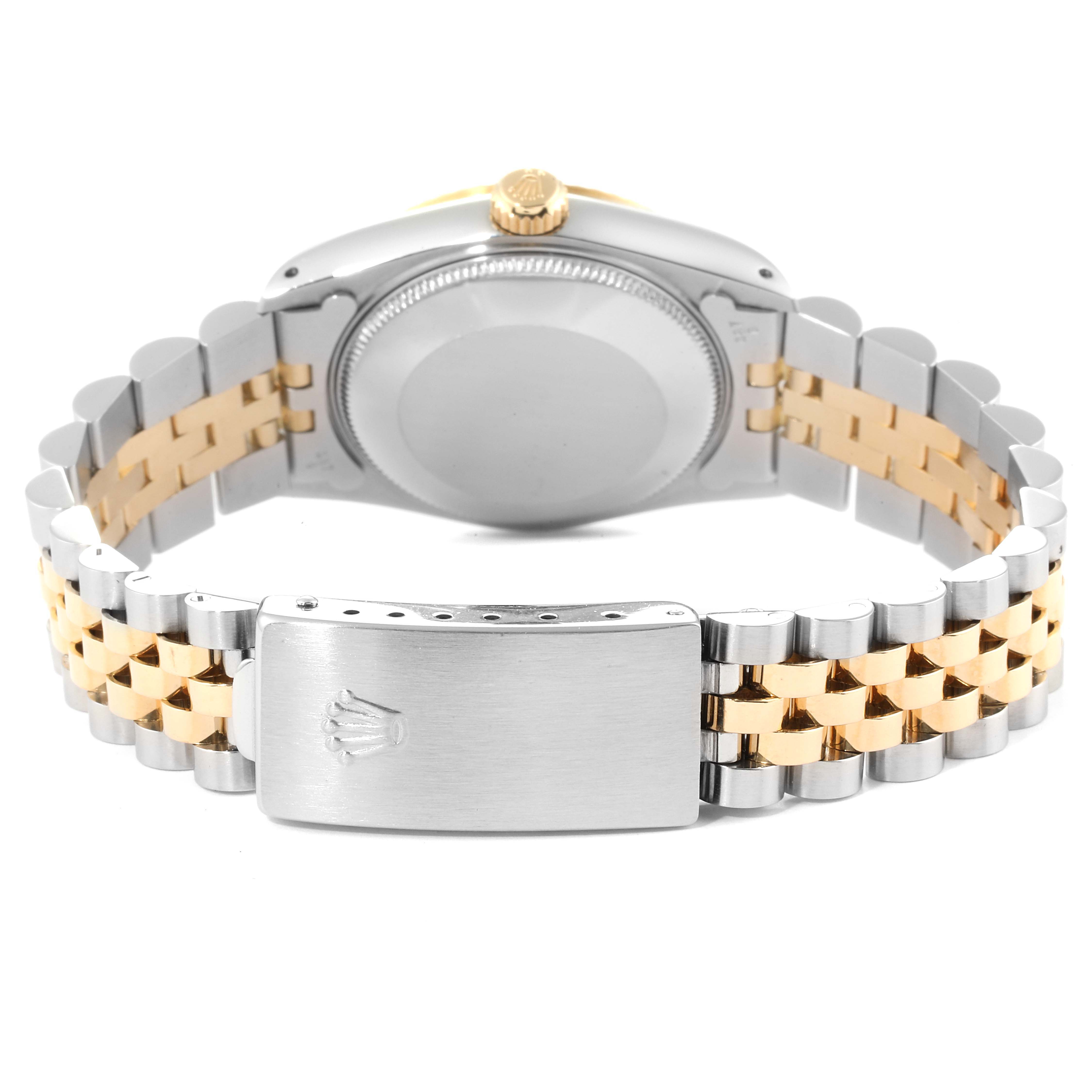 This image shows the back of the case, crown, and two-tone bracelet of the Rolex Mid-Size 68273 Women
s Steel and Gold (two tone) Champagne Dial 68273 Women
s Steel and Gold (two tone) Champagne Dial model.