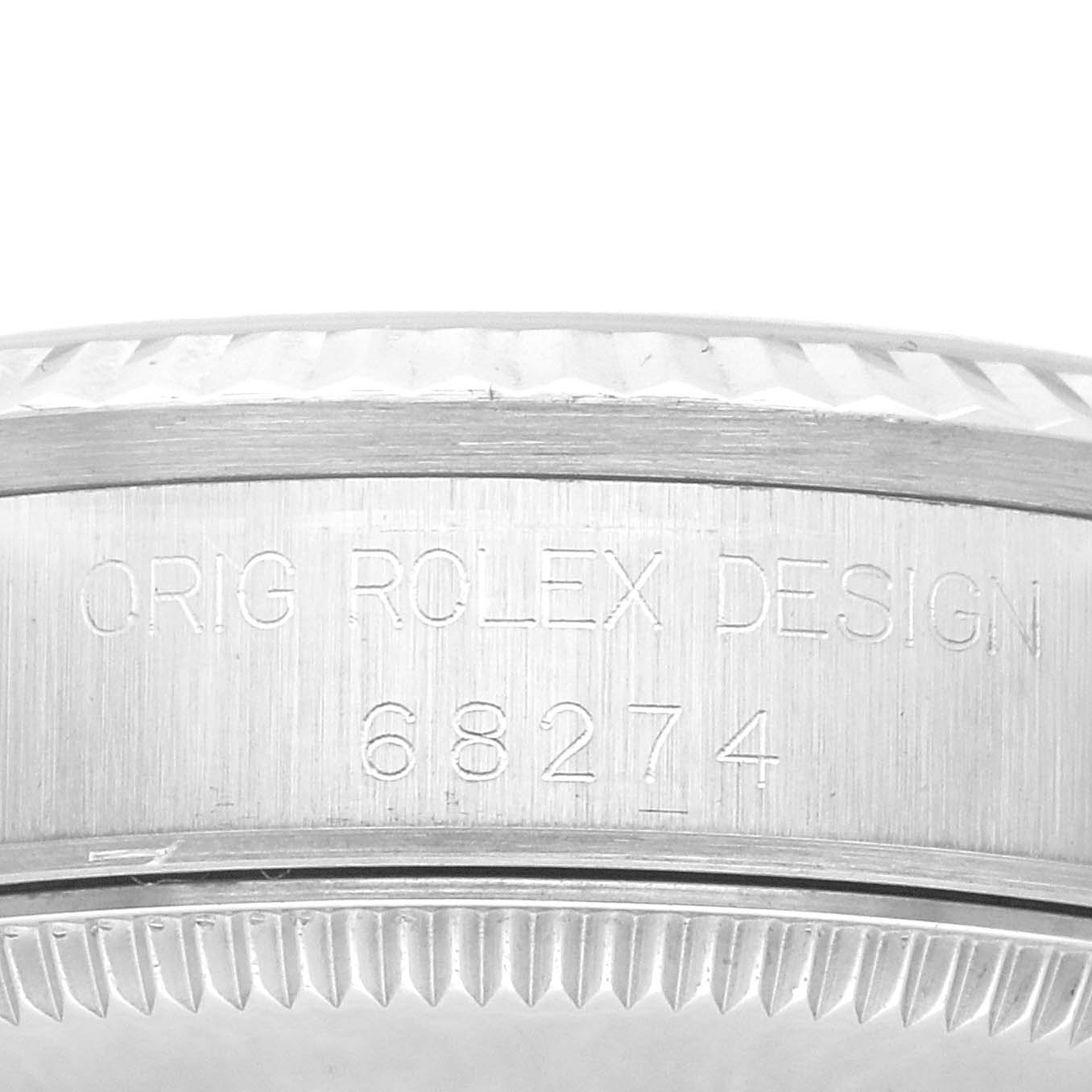 The image shows a close-up side view focusing on the engraved model number "68274" of the Rolex Mid-Size 68274 Women's Stainless Steel Silver Dial 68274 Women's Stainless Steel Silver Dial watch.