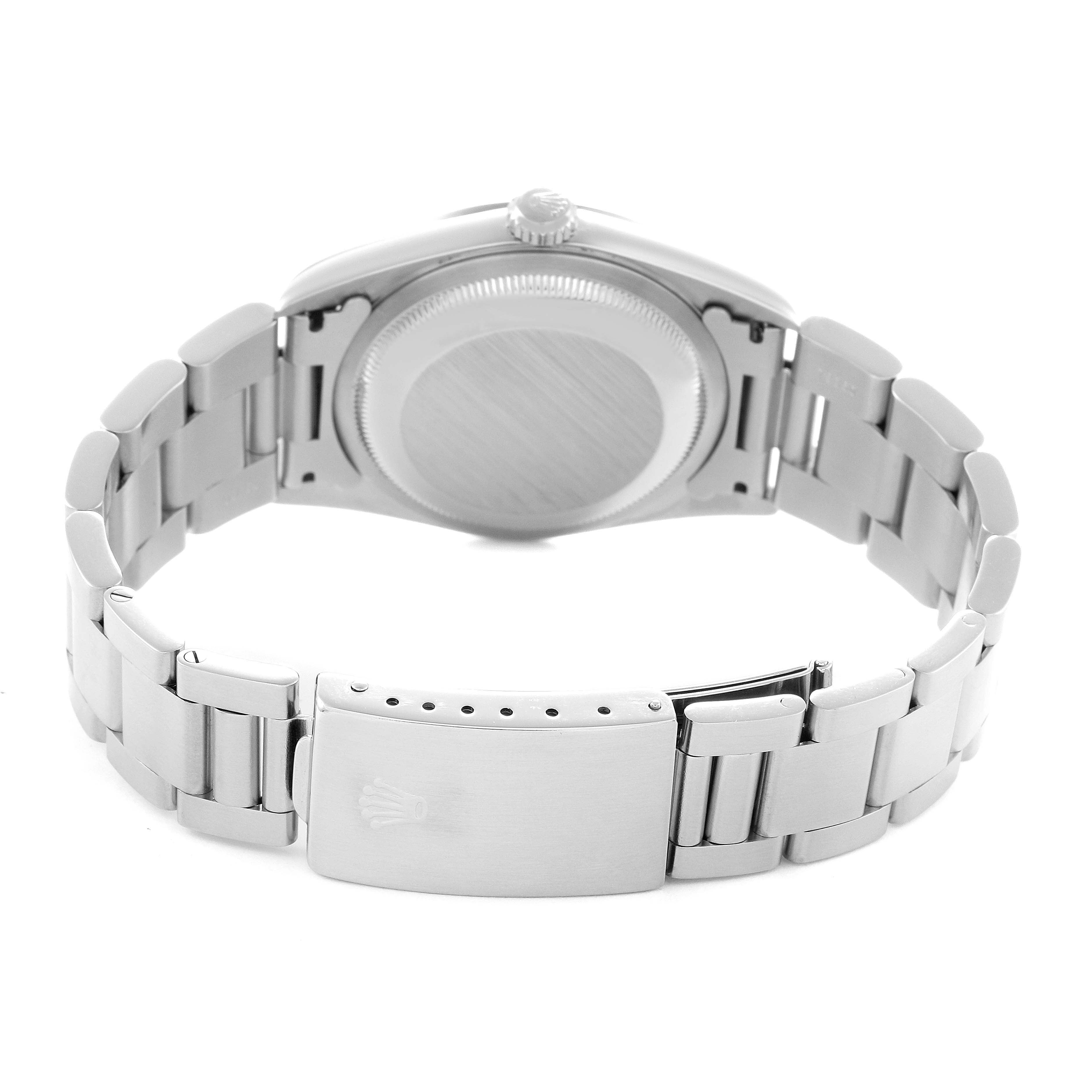 The image shows the back of a Rolex Datejust model 16200 men's watch, highlighting the closed clasp and case back from a rear angle.