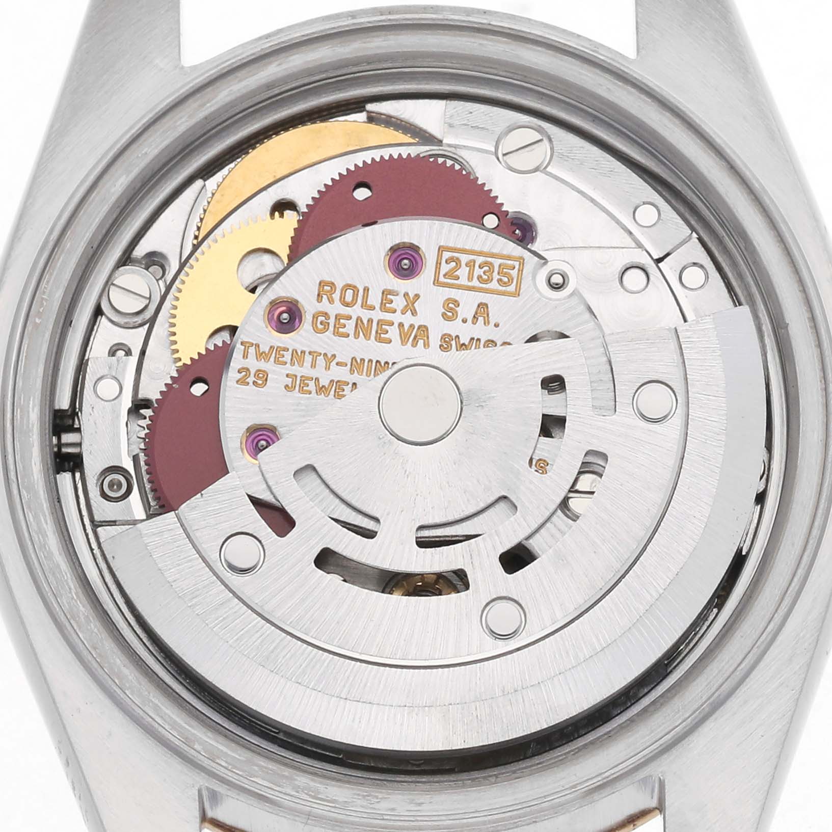 The image shows the movement of a Rolex Datejust model 69173, with visible mechanics and engravings, viewed from the back.