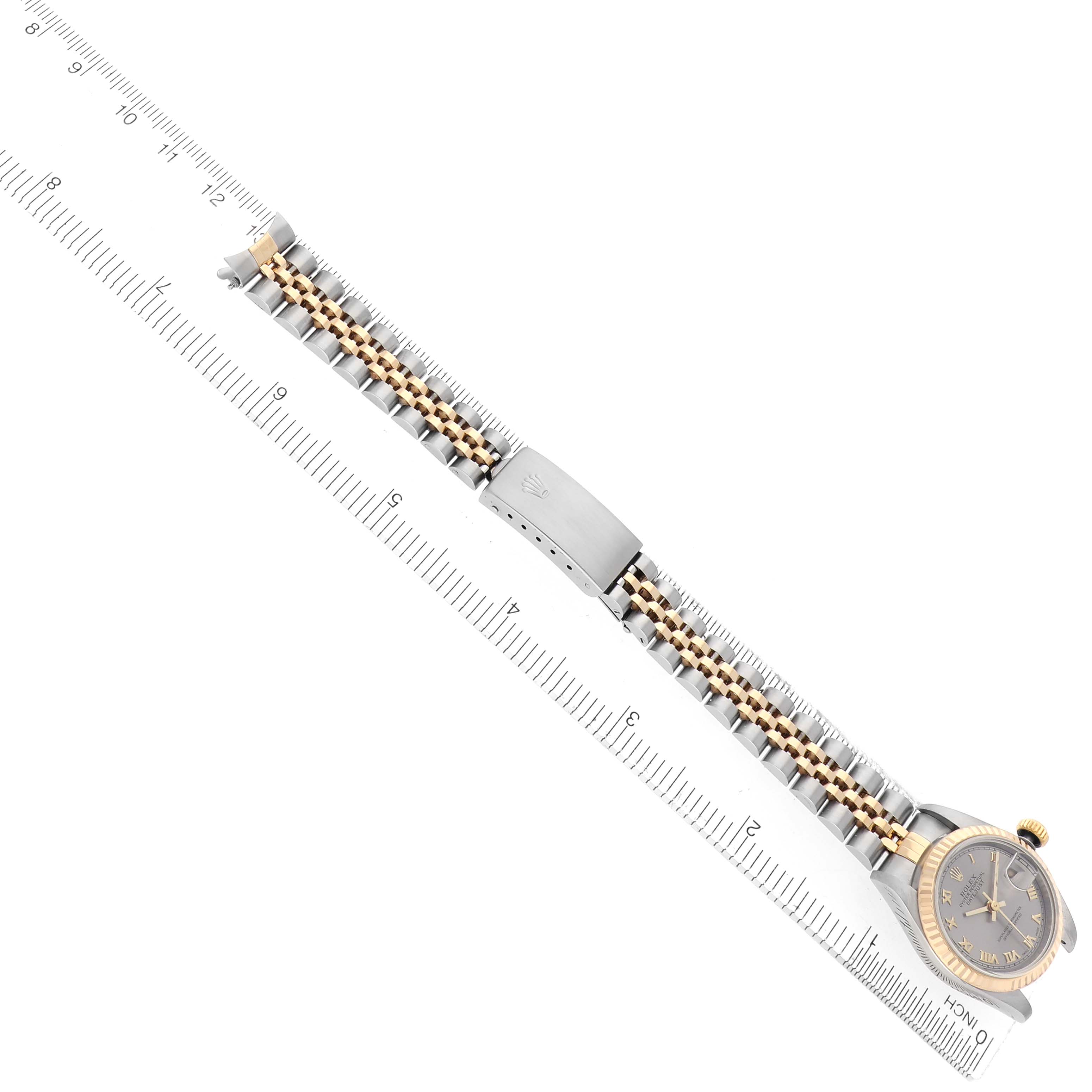 The image shows a Rolex Datejust model 69173 from a top-down angle, clearly displaying the watch face, bracelet, clasp, and a ruler for scale.