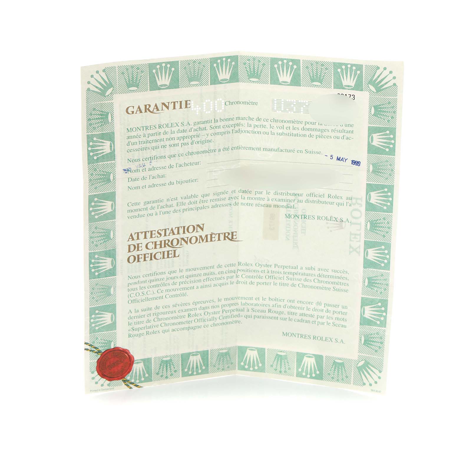 The image shows a close-up of the warranty certificate for a Rolex Datejust model 69173, featuring the brand's distinctive green border and crown logos.