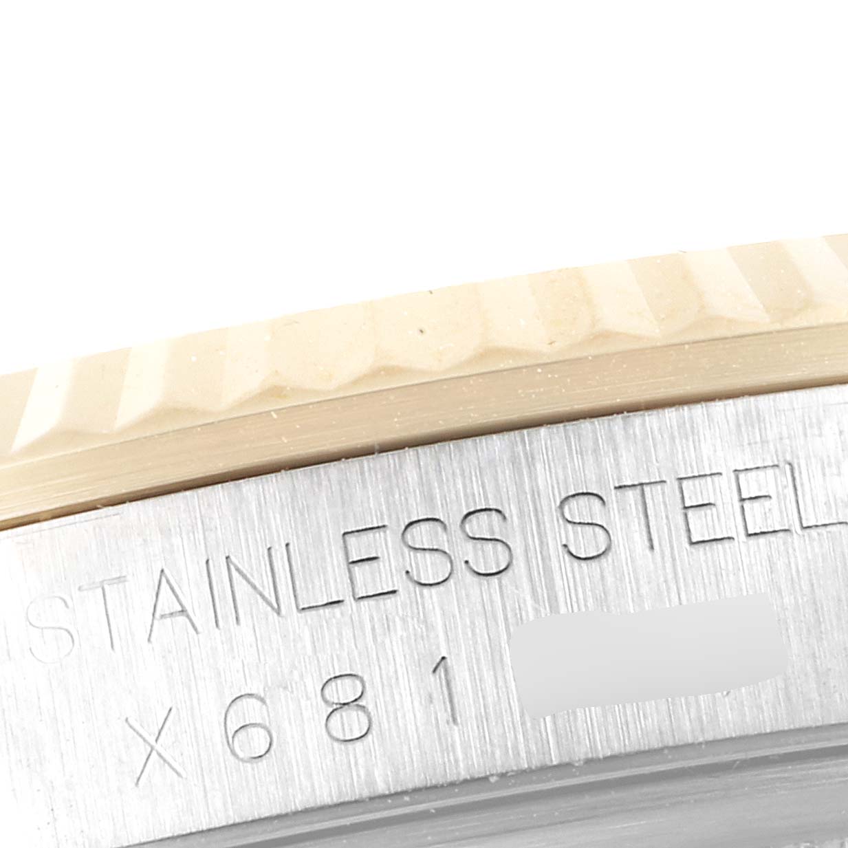 The image shows a close-up of the stainless steel casing and fluted bezel of a Rolex Datejust 16233 Men's Steel and Gold (two tone) Champagne Dial 16233 Men's Steel and Gold (two tone) Champagne Dial watch.