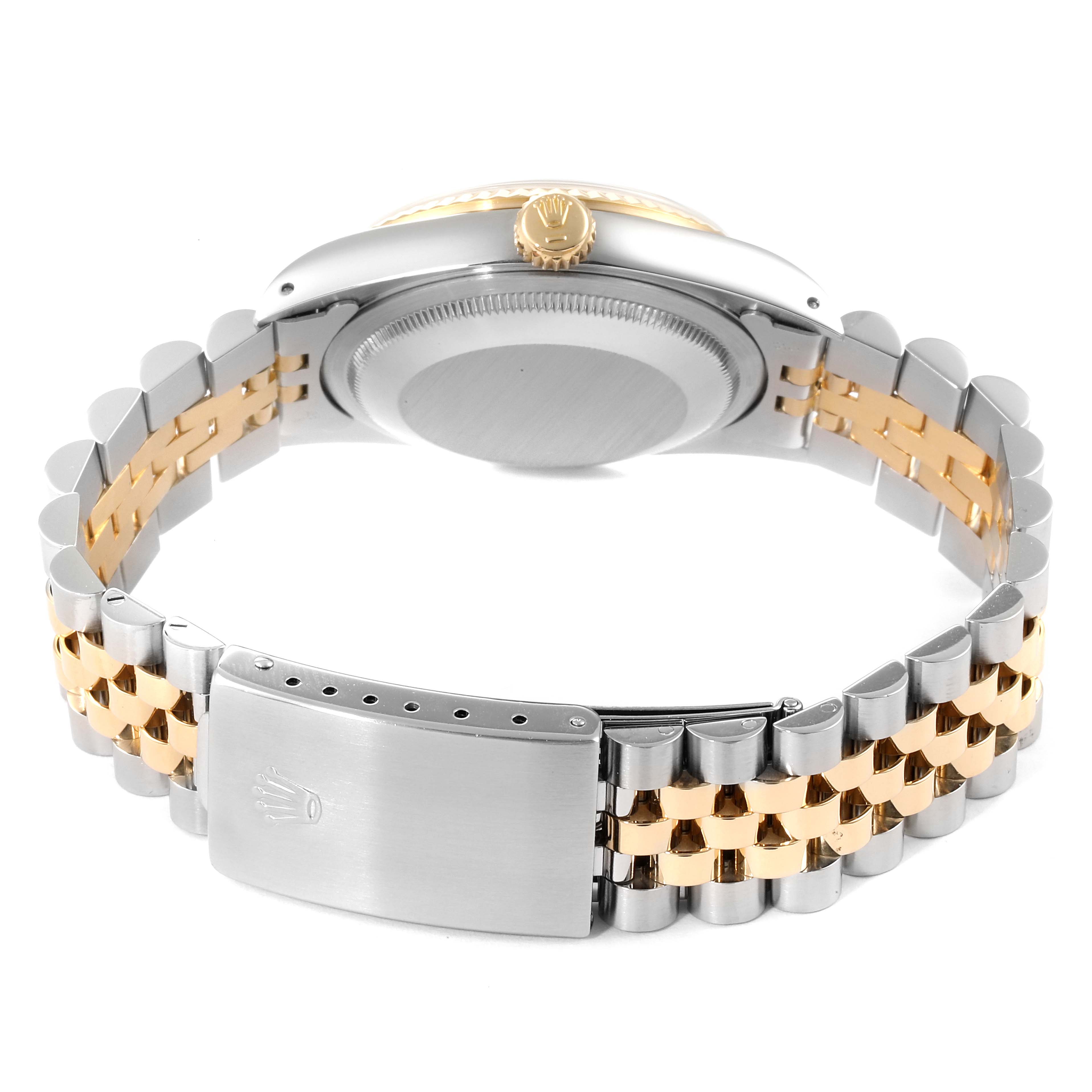 This image shows the back view of a Rolex Datejust 16233 Men's Steel and Gold (two tone) Champagne Dial 16233 Men's Steel and Gold (two tone) Champagne Dial watch, highlighting its case, crown, clasp, and two-tone bracelet.