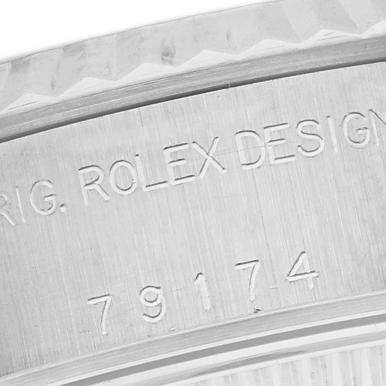 Close-up view of the side case engraving on a Rolex Datejust 79174 Women's Stainless Steel White Dial 79174 Women's Stainless Steel White Dial watch, displaying the serial and model numbers.