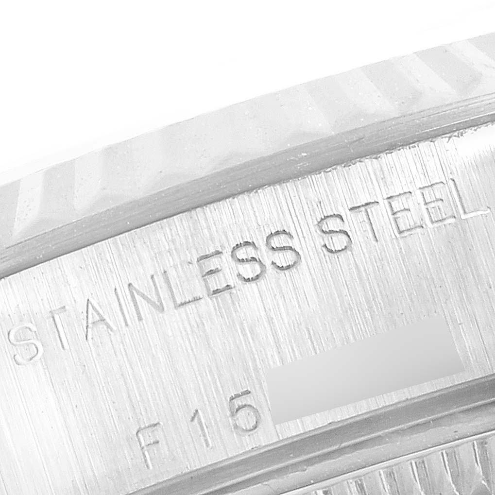 This image shows a close-up angle of the stainless steel bezel and engraving on the Rolex Datejust 79174 Women
s Stainless Steel Silver Dial 79174 Women
s Stainless Steel Silver Dial watch.