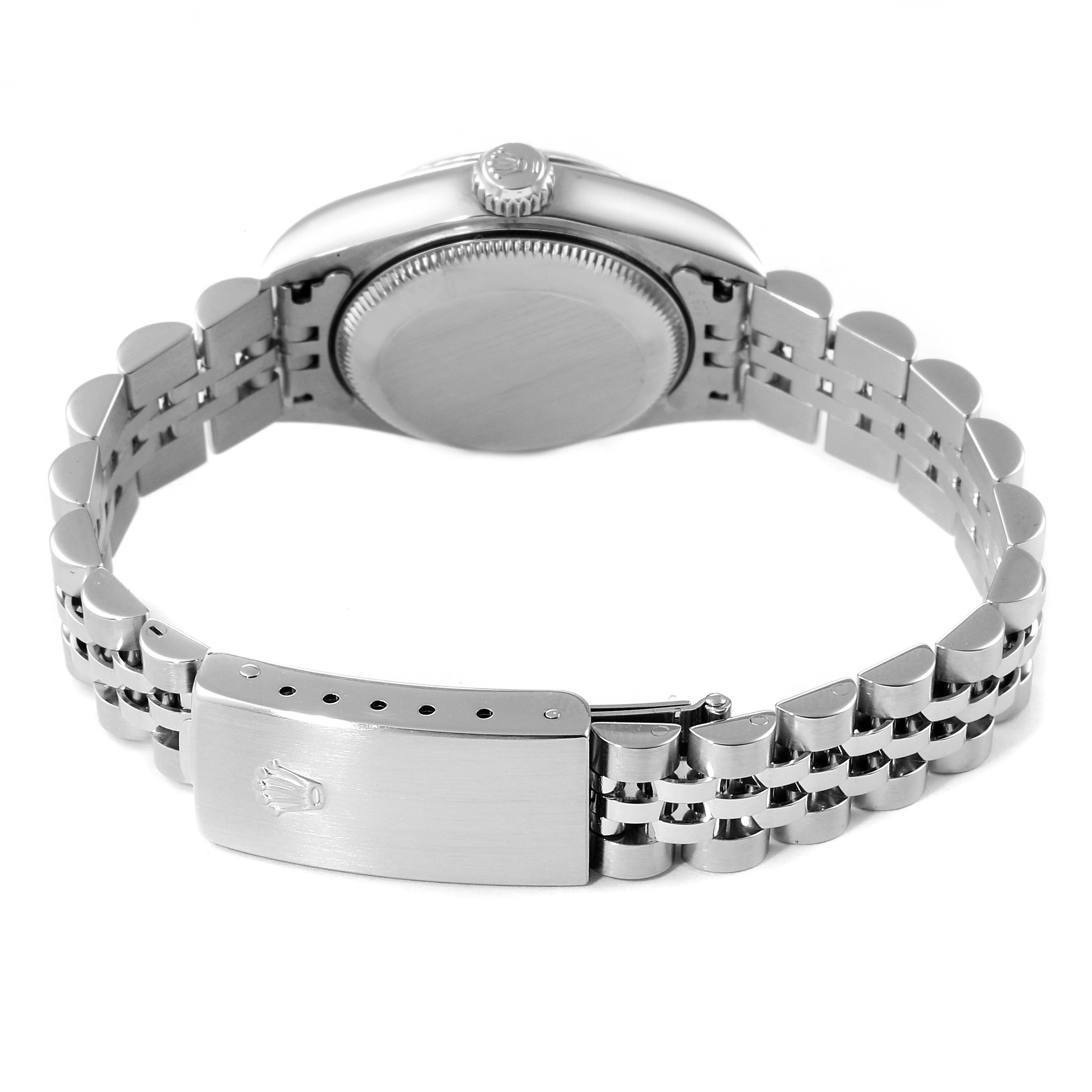 The image shows the backside of a Rolex Datejust 79174 Women
s Stainless Steel Silver Dial 79174 Women
s Stainless Steel Silver Dial watch, highlighting the clasp, bracelet, and case back.