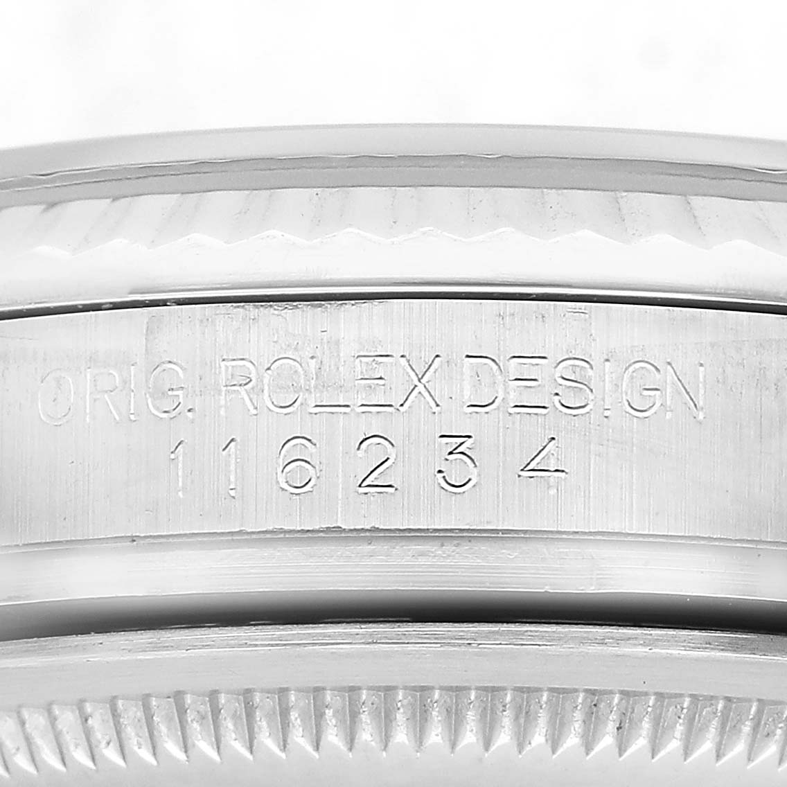 The image shows a close-up of the side engraving on a Rolex Datejust 116234 Men's Stainless Steel Silver Dial model, displaying the design and serial number.
