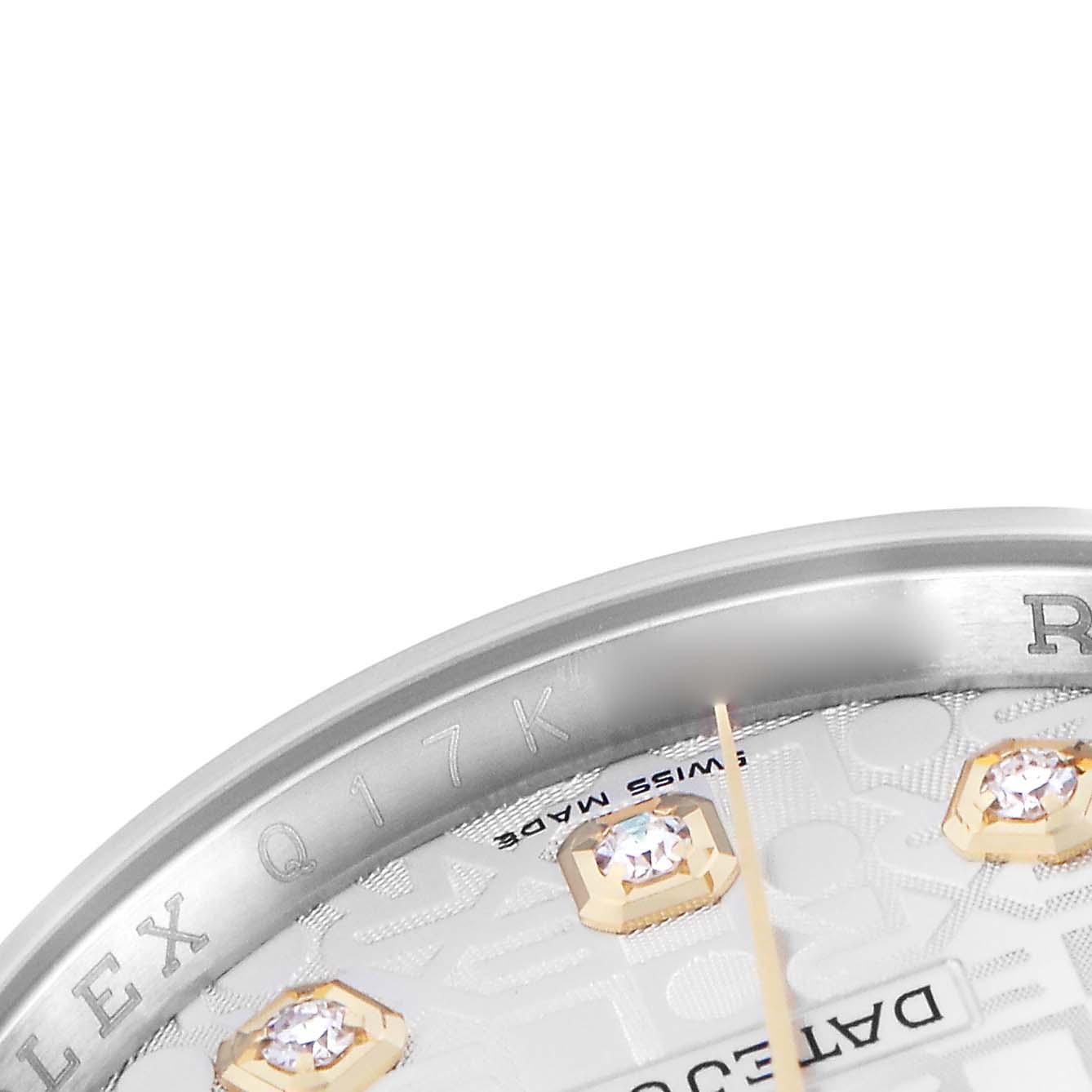 The image shows a close-up of the Rolex Datejust model 116233, highlighting the edge of the dial with diamond markers and part of the watch case.