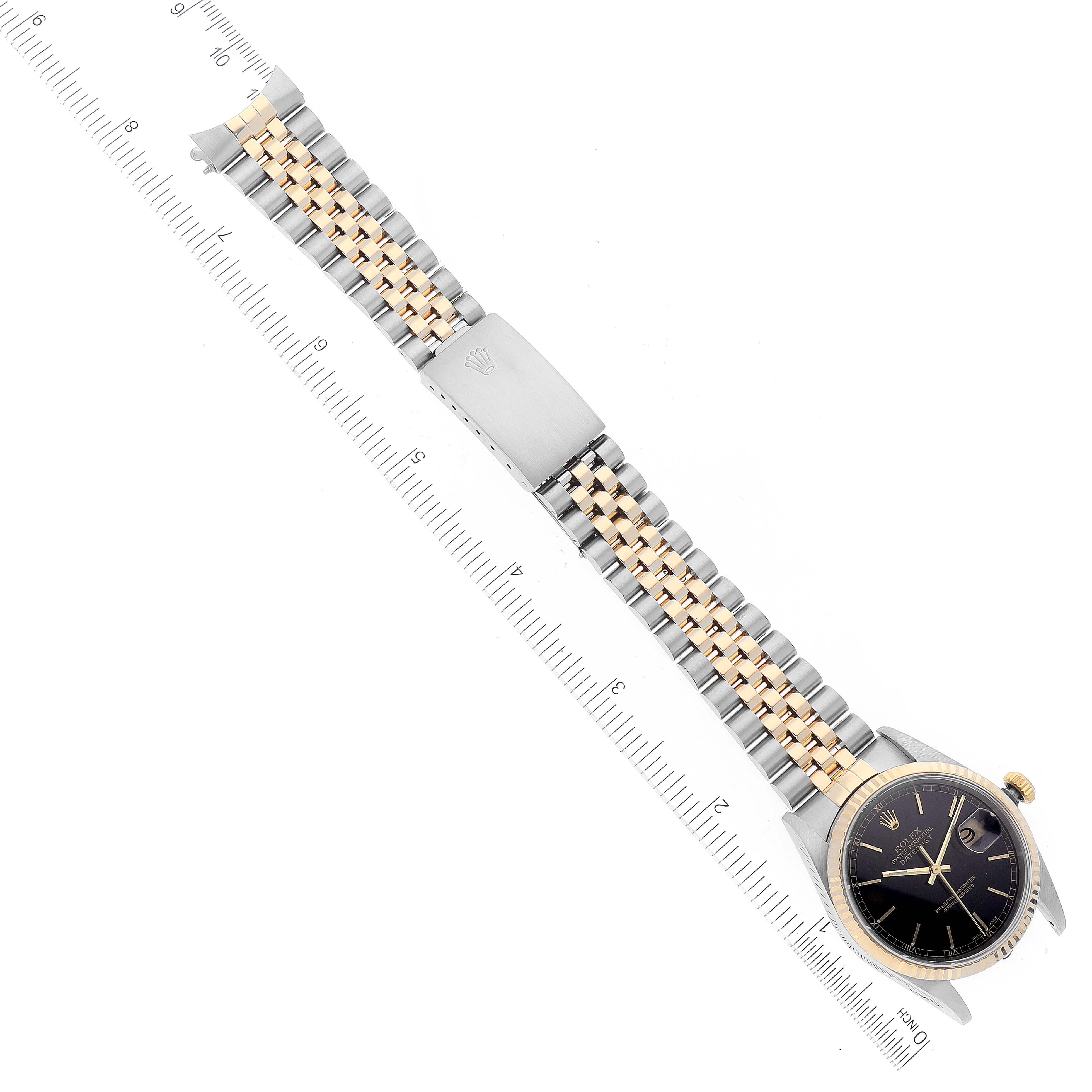 The Rolex Datejust 16233 Men's Steel and Gold (two tone) Black Dial 16233 Men's Steel and Gold (two tone) Black Dial watch is shown from a top-down angle, displaying the face, bezel, and metal bracelet.