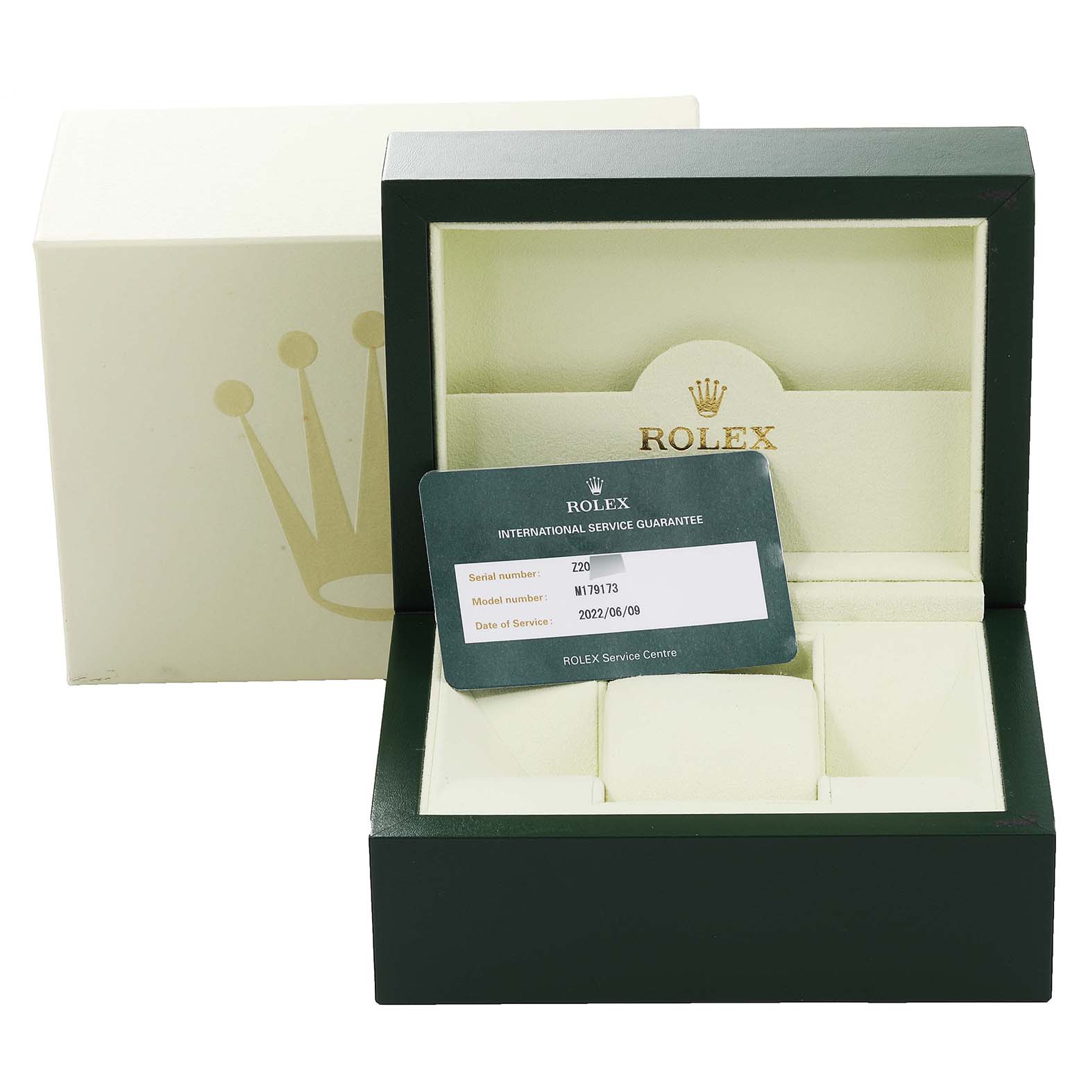 The image shows the packaging, box, and an international service guarantee card for a Rolex Datejust 179173 Women's Steel and Gold (two tone) Champagne Dial 179173 Women's Steel and Gold (two tone) Champagne Dial watch.
