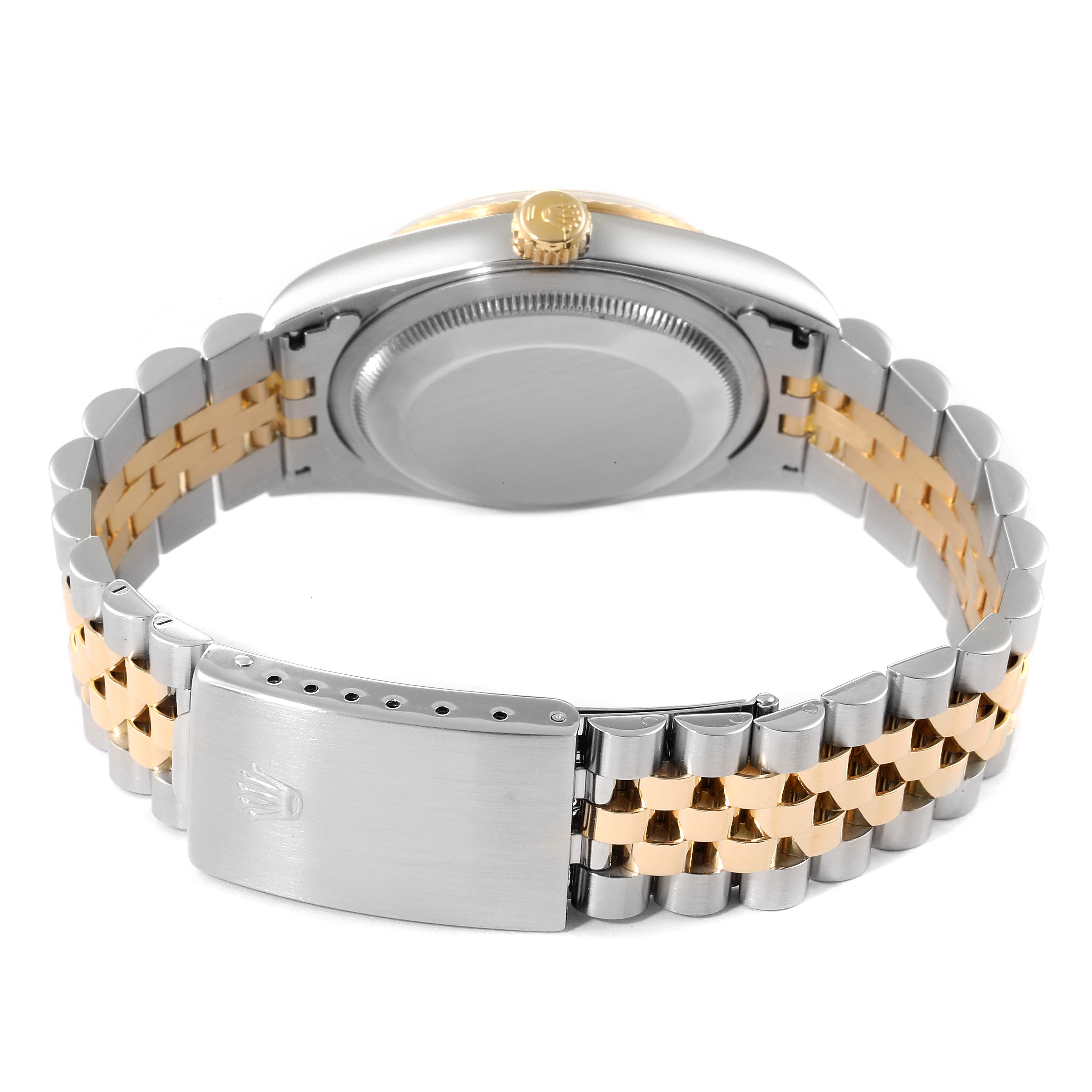 This image shows the back view of a Rolex Datejust 16233 Men's Steel and Gold (two tone) Champagne Dial 16233 Men's Steel and Gold (two tone) Champagne Dial watch, highlighting its case back, crown, and two-tone jubilee bracelet clasp.