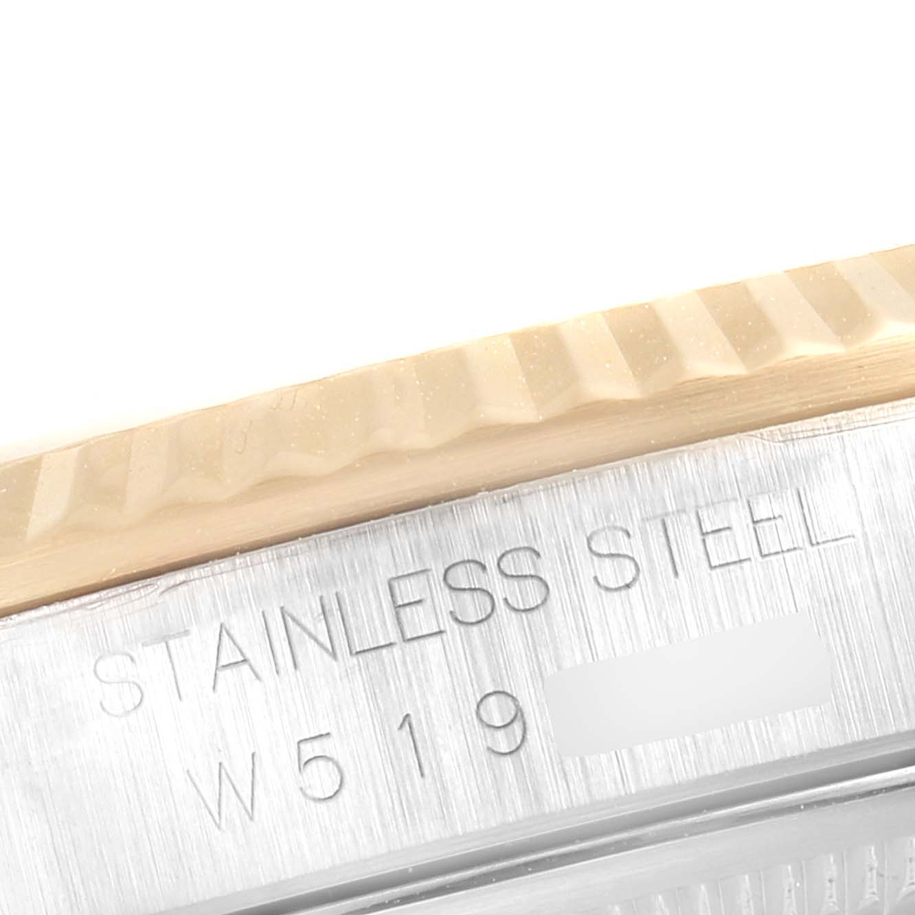 The image shows a close-up of the stainless steel case and fluted bezel of a Rolex Datejust 16233 Men's Steel and Gold (two tone) Champagne Dial 16233 Men's Steel and Gold (two tone) Champagne Dial watch.