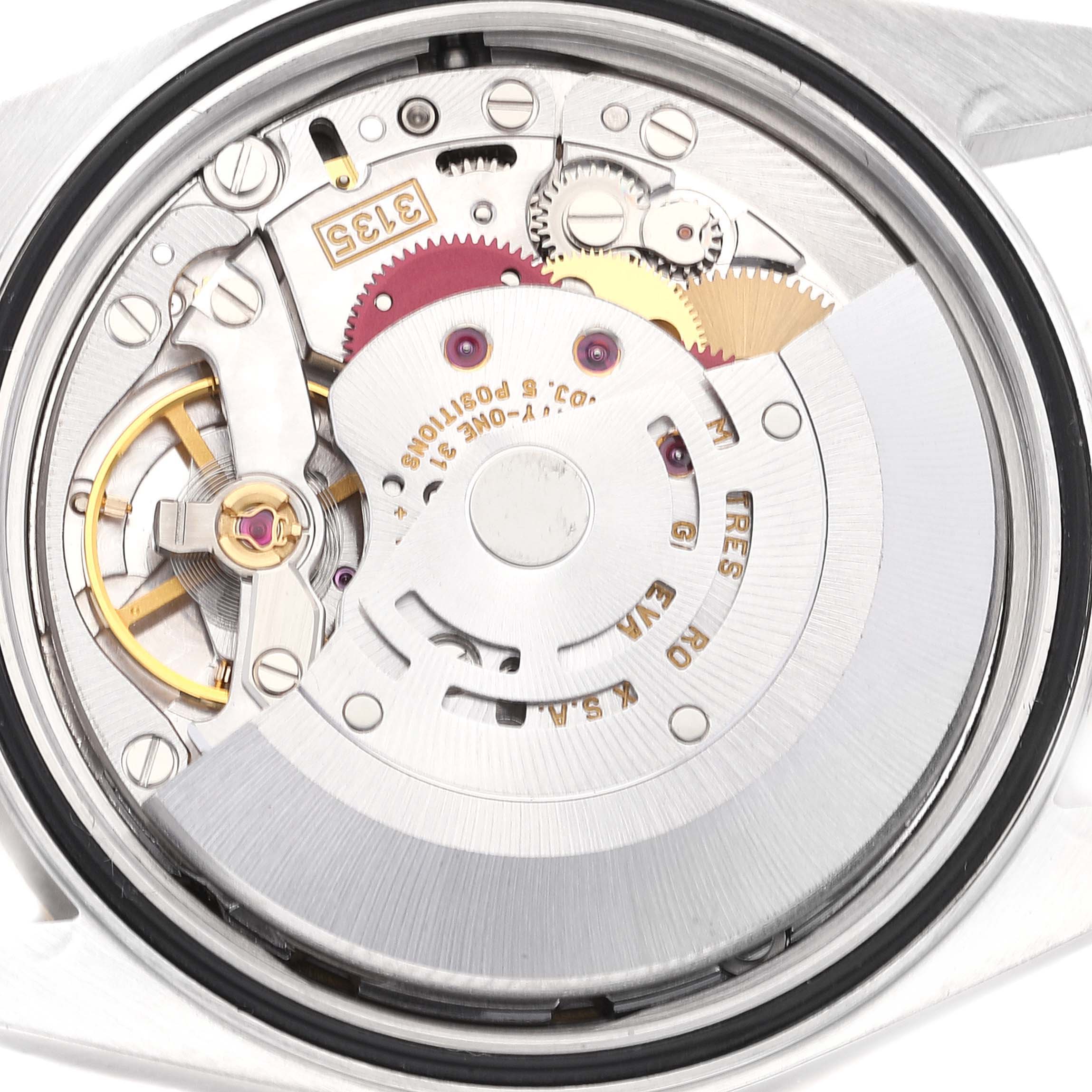 This image shows the internal mechanism of a Rolex Datejust 16233 Men's Steel and Gold (two tone) Champagne Dial 16233 Men's Steel and Gold (two tone) Champagne Dial watch from a rear angle, highlighting its intricate components.