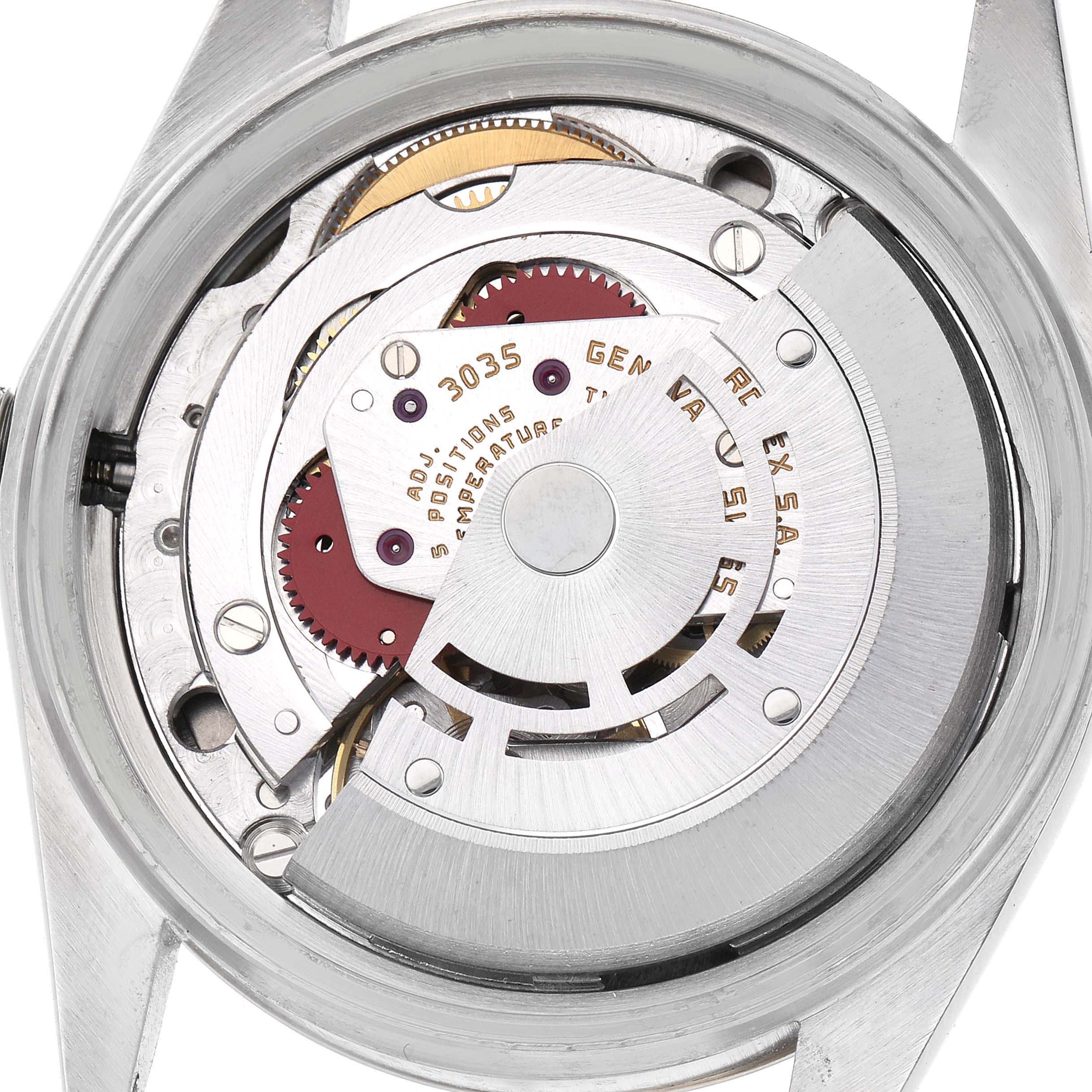 The image shows the movement mechanism of the Rolex Vintage Collection model 16013 men's watch, viewed from the back with detailed gears and components exposed.