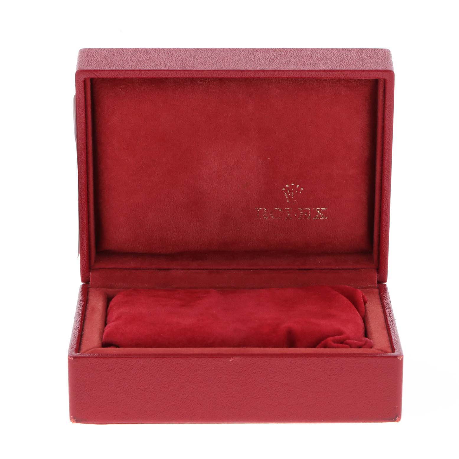 This image shows a red Rolex Datejust 69173 Women
s Steel and Gold (two tone) Champagne Dial 69173 Women
s Steel and Gold (two tone) Champagne Dial watch box, open to reveal its red interior and padding.