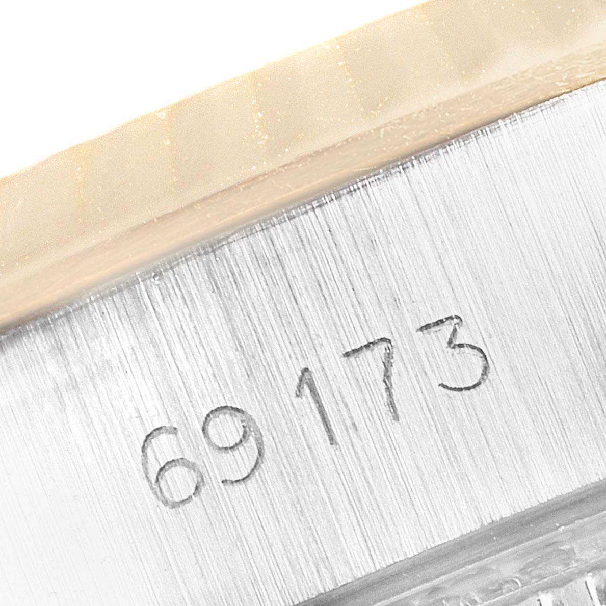 The image shows a close-up angle of the model number "69173" engraved on the side of a Rolex Datejust 69173 Women
s Steel and Gold (two tone) Champagne Dial 69173 Women
s Steel and Gold (two tone) Champagne Dial watch.
