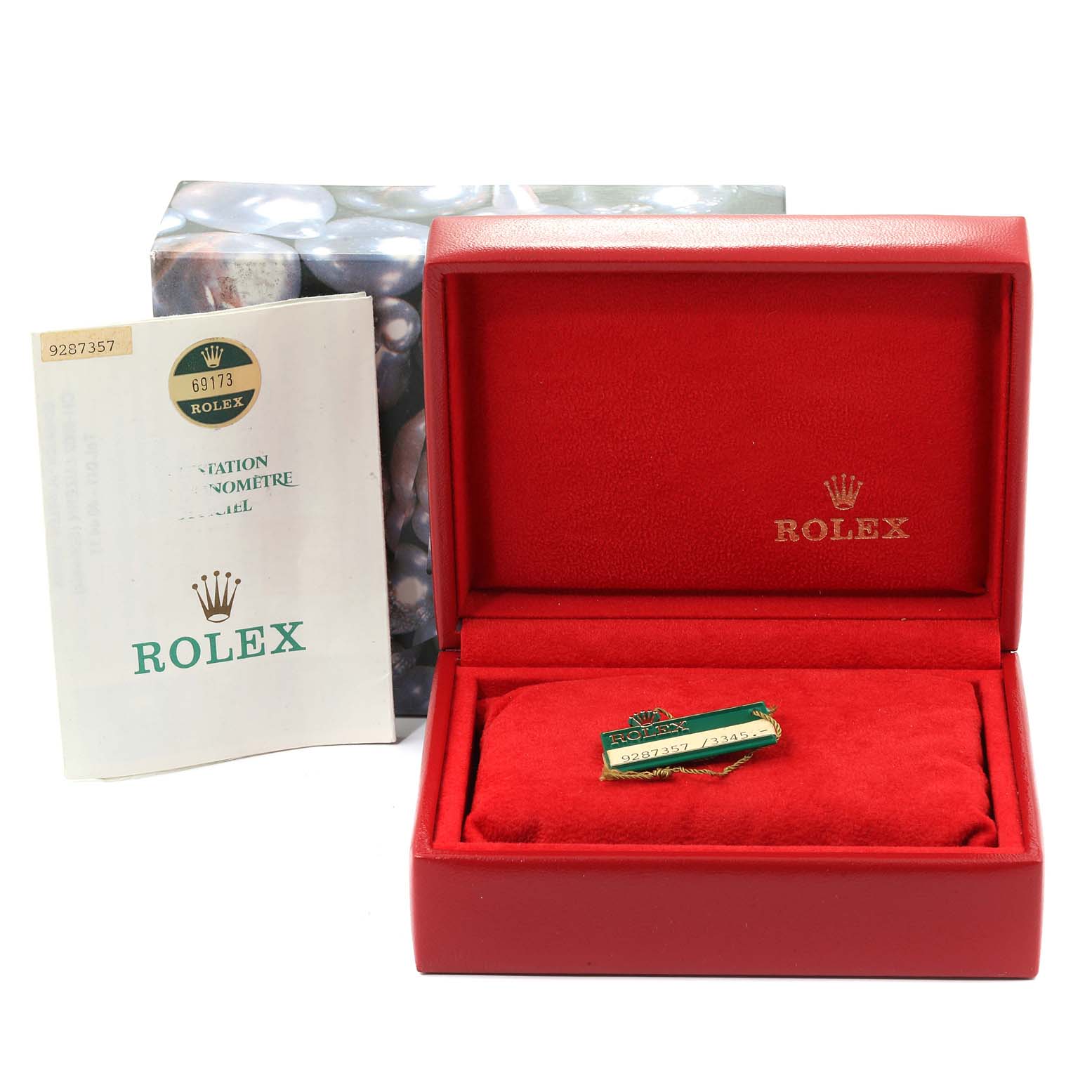 The image shows a Rolex Datejust 69173 Women
s Steel and Gold (two tone) Champagne Dial 69173 Women
s Steel and Gold (two tone) Champagne Dial watch box, a tag, and accompanying documentation from a front angle.