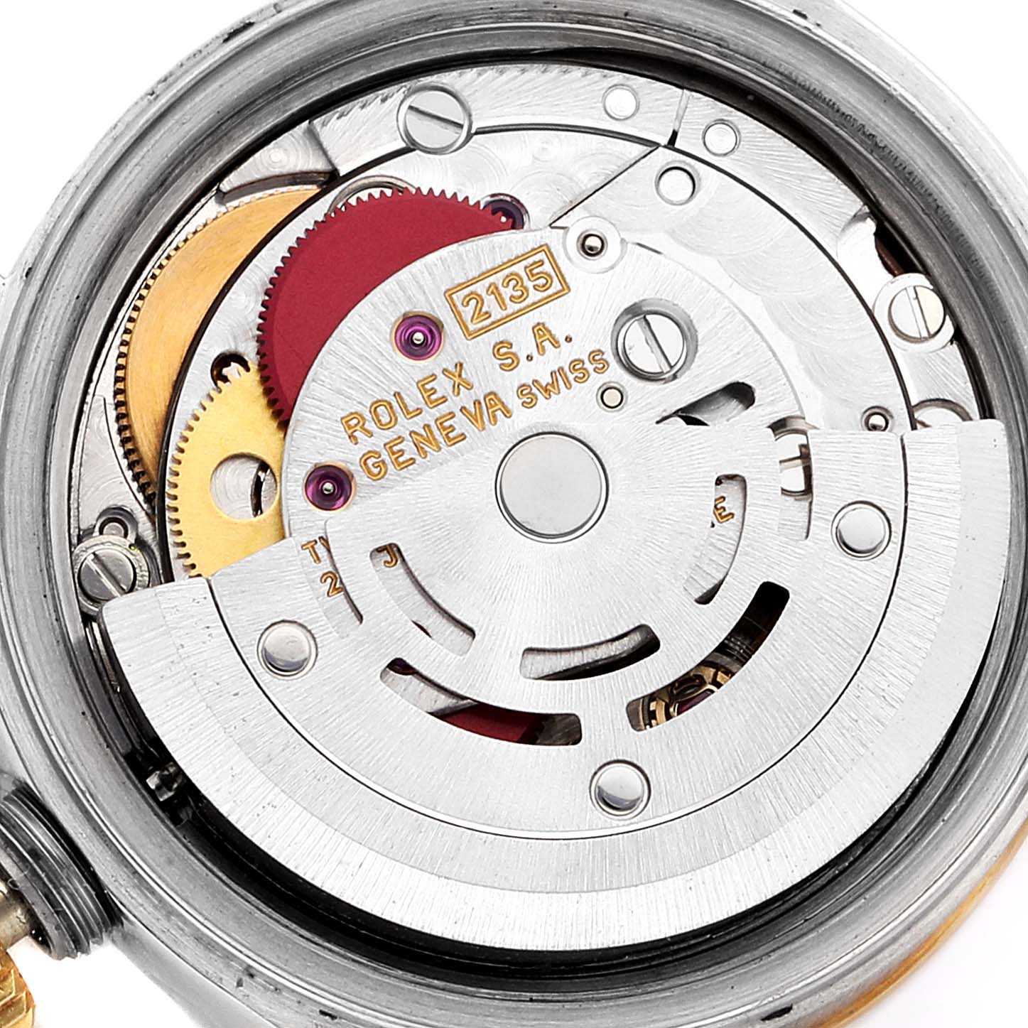 This image shows the internal mechanism of a Rolex Datejust 69163 Women
s Steel and Gold (two tone) Mother of Pearl Dial 69163 Women
s Steel and Gold (two tone) Mother of Pearl Dial watch, highlighting gears and the rotor from a top-down angle.