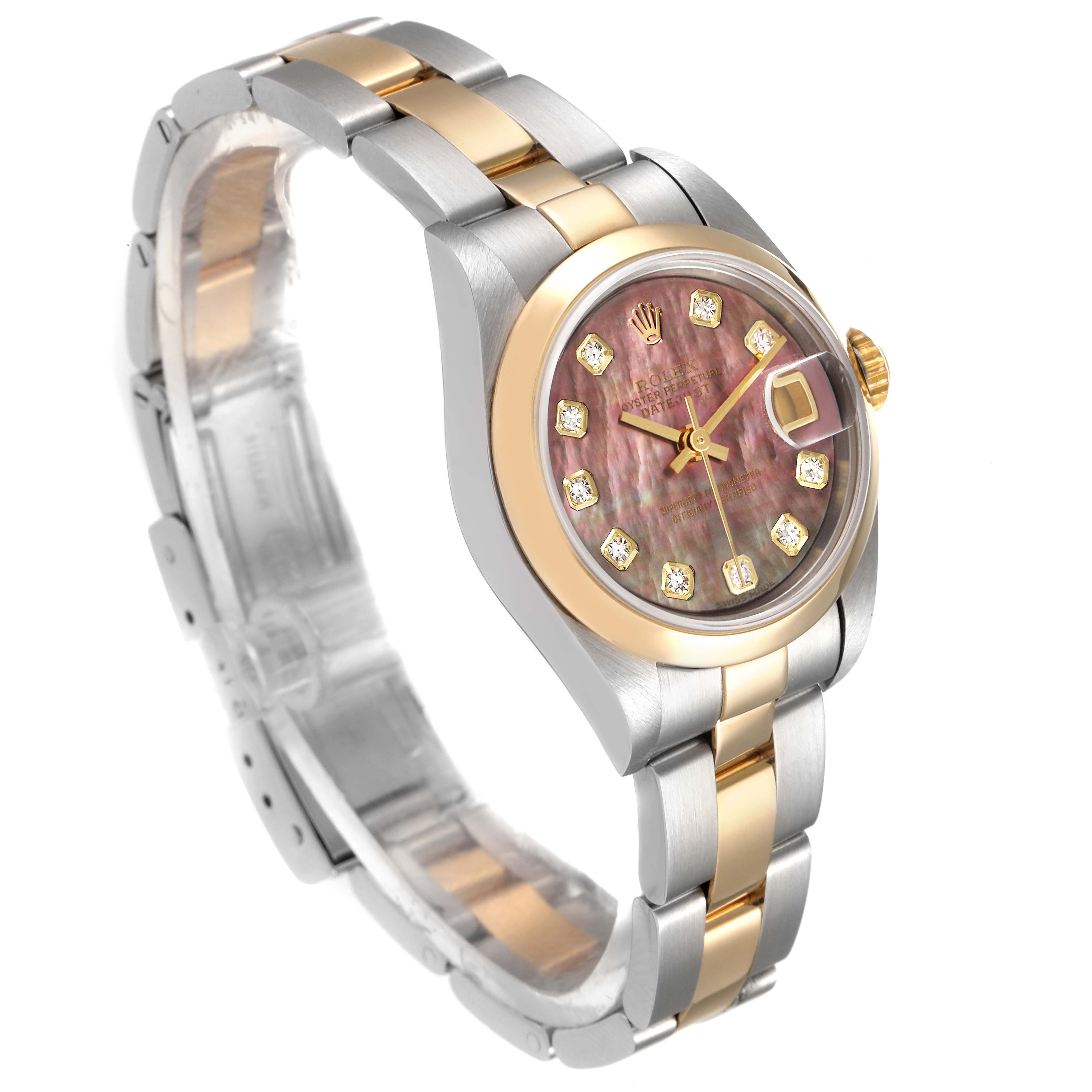 The image shows a Rolex Datejust 79163 Women
s Steel and Gold (two tone) Mother of Pearl Dial 79163 Women
s Steel and Gold (two tone) Mother of Pearl Dial watch at a three-quarter angle, highlighting its two-tone bracelet and dial, and cyclops lens.