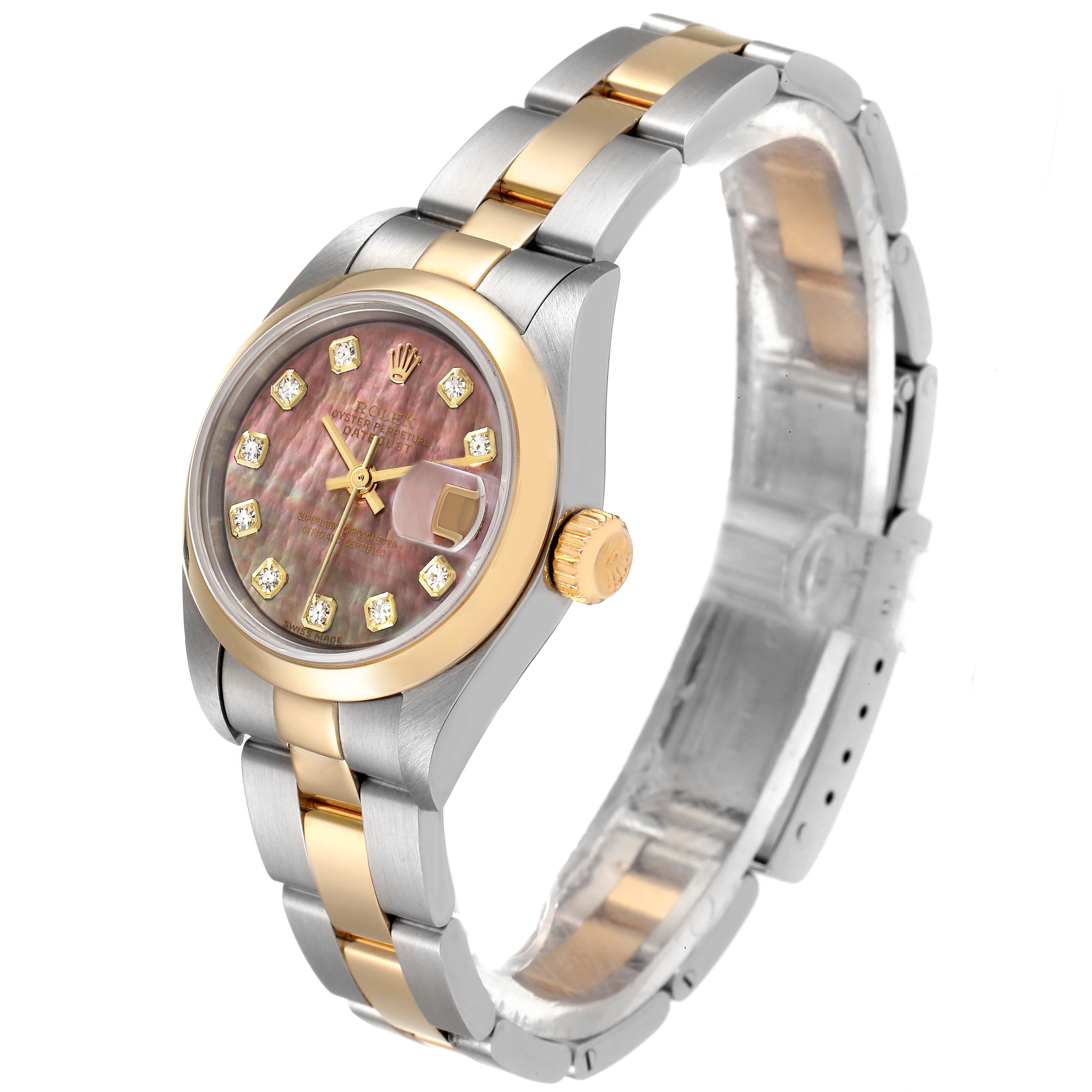 This image shows a Rolex Datejust 79163 Women
s Steel and Gold (two tone) Mother of Pearl Dial 79163 Women
s Steel and Gold (two tone) Mother of Pearl Dial watch at a slight angle, featuring its dial, crown, and two-tone bracelet.