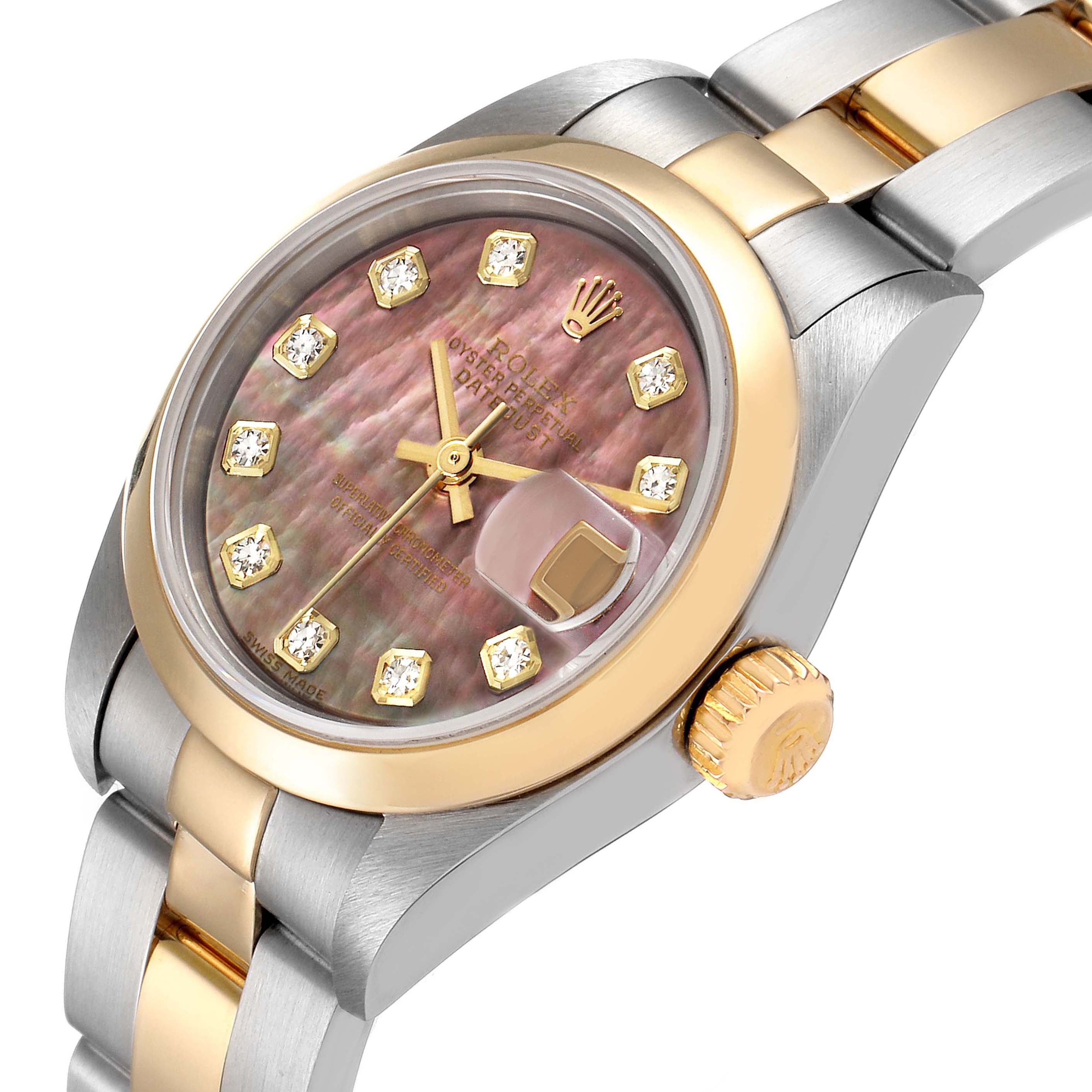 The image shows a close-up of a Rolex Datejust 79163 Women
s Steel and Gold (two tone) Mother of Pearl Dial 79163 Women
s Steel and Gold (two tone) Mother of Pearl Dial watch, highlighting the dial, bezel, and part of the bracelet.